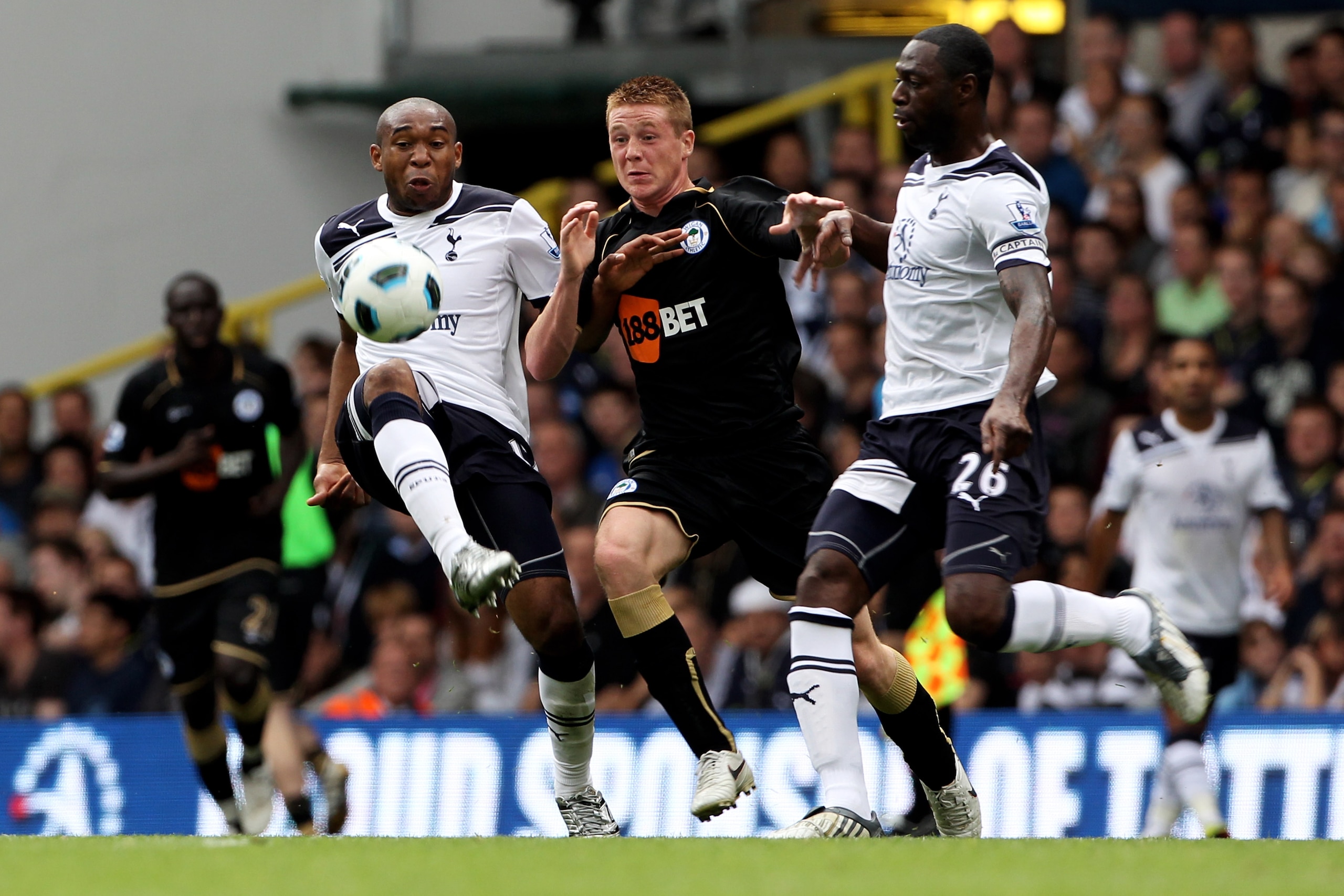 LONDON, ENGLAND - AUGUST 28: Wilson Palacios (L) and Ledley King (R) of Tottenham battle for the ball with James McCarthy of Wigan during the Barclays Premier League match between Tottenham Hotspur and Wigan Athletic at White Hart Lane on August 28, 2010 LONDON, ENGLAND - AUGUST 28: Wilson Palacios (L) and Ledley King (R) of Tottenham battle for the ball with James McCarthy of Wigan during the Barclays Premier League match between Tottenham Hotspur and Wigan Athletic at White Hart Lane on August 28, 2010