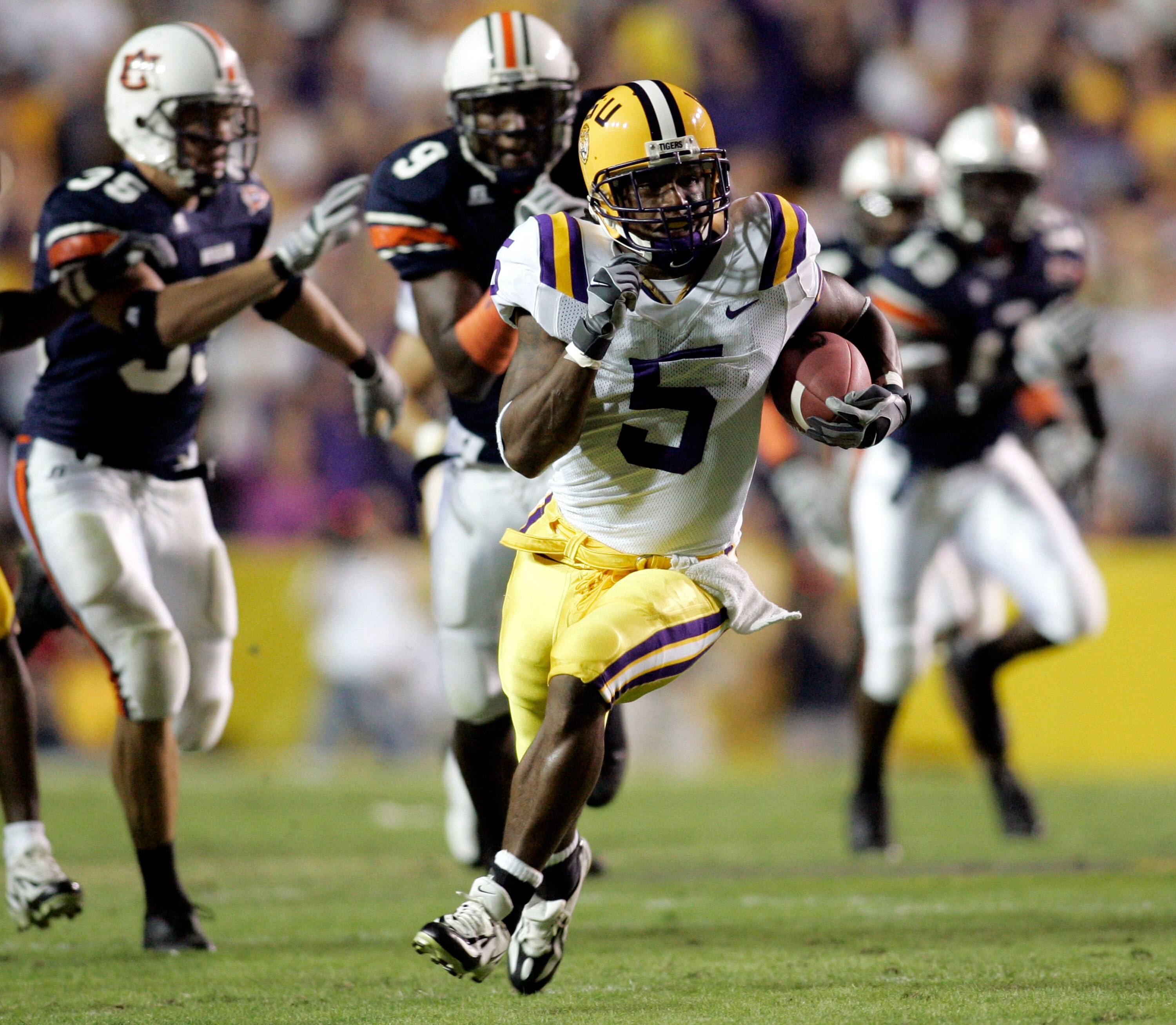 BATON ROUGE, LA - OCTOBER 22:  Skyler Green #5  of Louisiana State University runs past the Auburn University defense to score a 65-yard touchdown on a punt return on October 22, 2005 at Tiger Stadium in Baton Rouge, Louisiana.   (Photo by Chris Graythen/