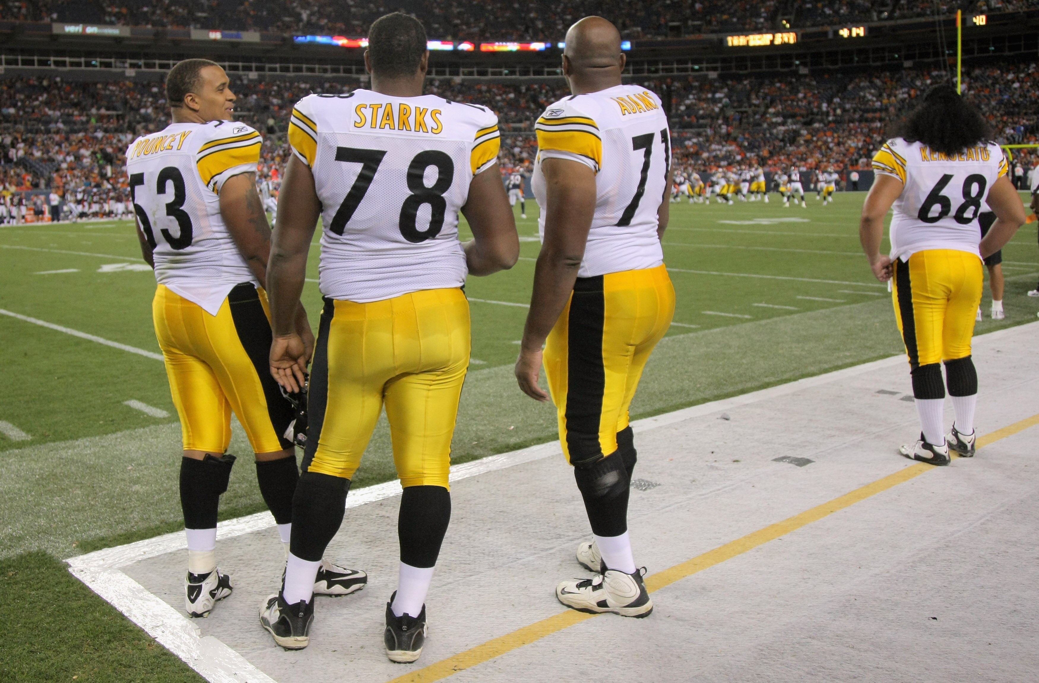 DENVER - AUGUST 29:  Offensive linemen Maurkice Pouncey #53, Max Starks #78, Flozell Adams #71 and Chris Kemoeatu #68 of the Pittsburgh Steelers watch from the sideline as they prepare for action against the Denver Broncos during preseason NFL action at I