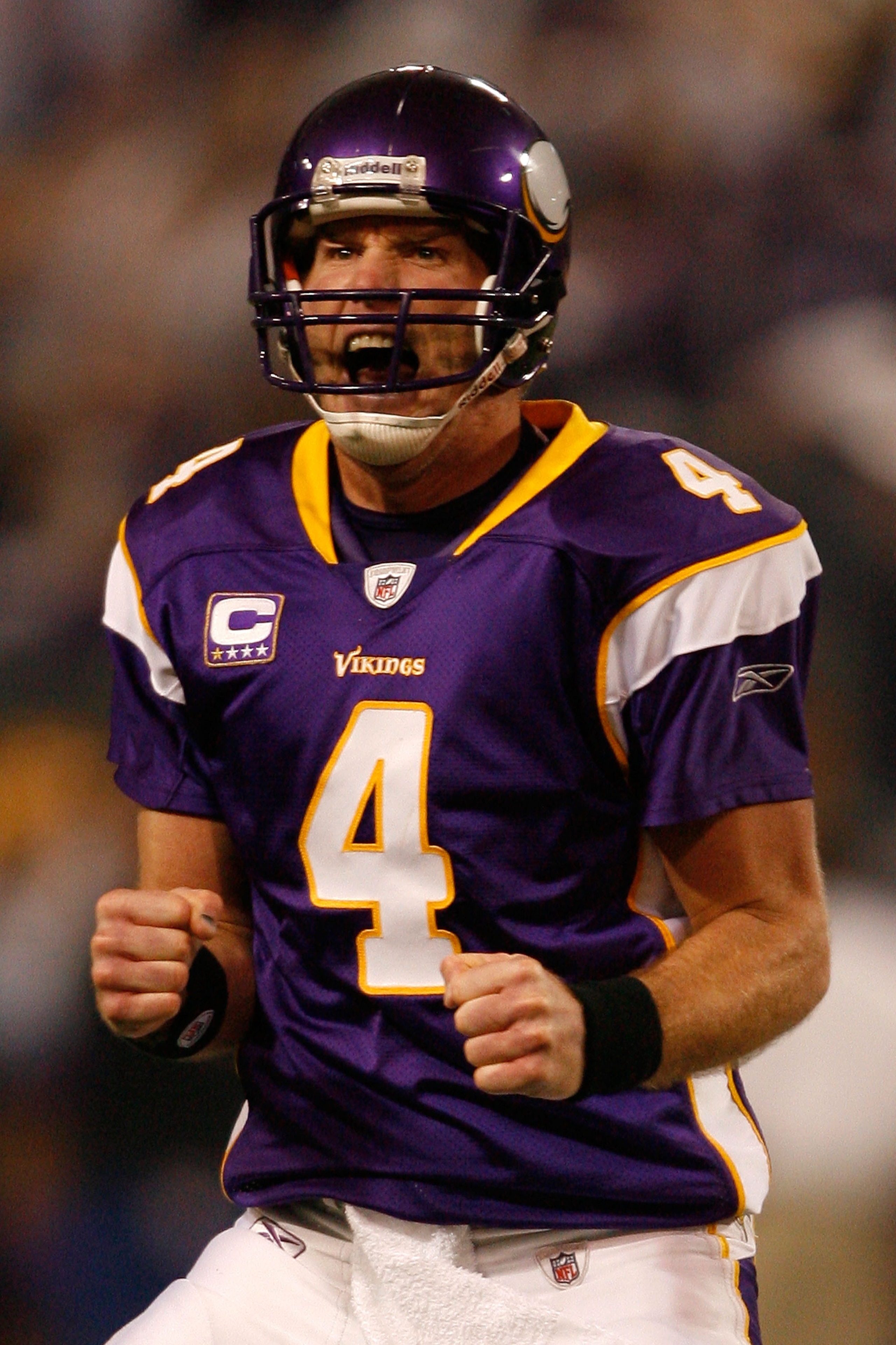 MINNEAPOLIS - JANUARY 17:  Quarterback Brett Favre #4 of the Minnesota Vikings celebrates touchdown in the second quarter against the Dallas Cowboys during the NFC Divisional Playoff Game at Hubert H. Humphrey Metrodome on January 17, 2010 in Minneapolis,