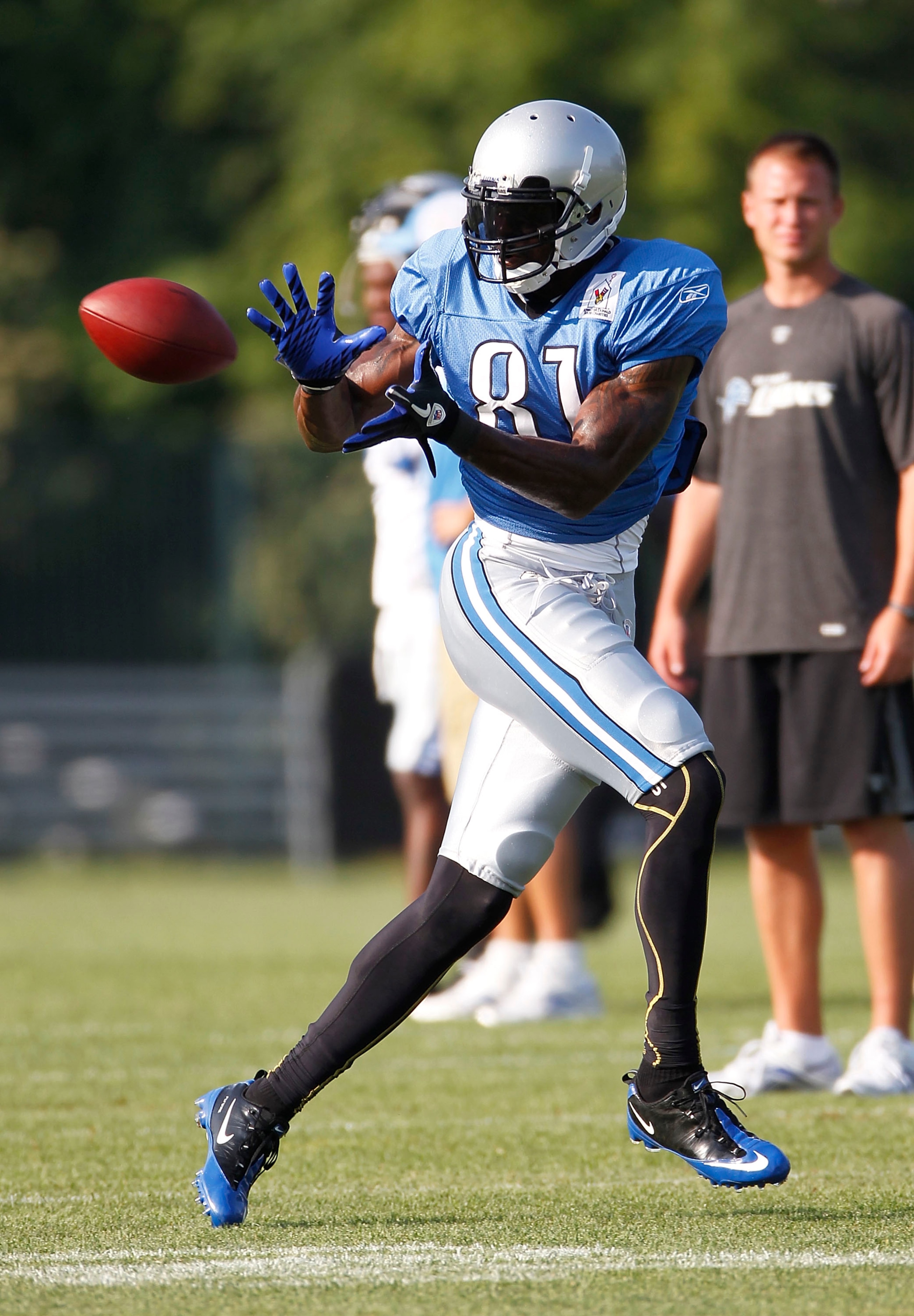 ALLEN PARK, MI - AUGUST 05: Calvin Johnson #81 of the Detroit Lions catches a pass during training camp at the Detroit Lions Headquarters and Training Facility on August 5, 2010 in Allen Park, Michigan. (Photo by Gregory Shamus/Getty Images) ALLEN PARK, MI - AUGUST 05: Calvin Johnson #81 of the Detroit Lions catches a pass during training camp at the Detroit Lions Headquarters and Training Facility on August 5, 2010 in Allen Park, Michigan. (Photo by Gregory Shamus/Getty Images)