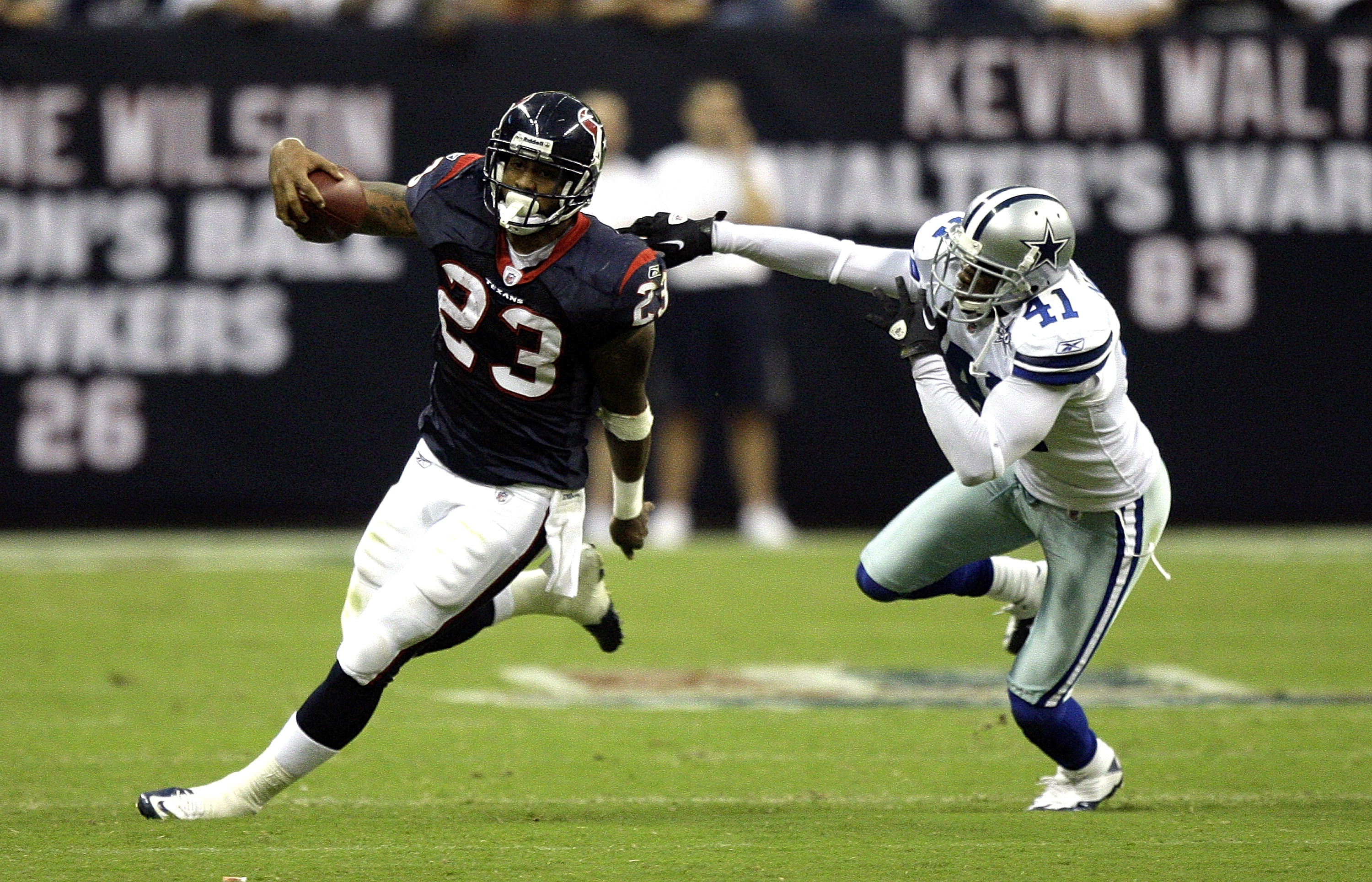 HOUSTON - AUGUST 28:  Running back Arian Foster #23 of the Houston Texans avoids a tackle from cornerback Terrence Newman #41 of the Dallas Cowboys in the first quarter of a preseason game at Reliant Stadium on August 28, 2010 in Houston, Texas.  (Photo b