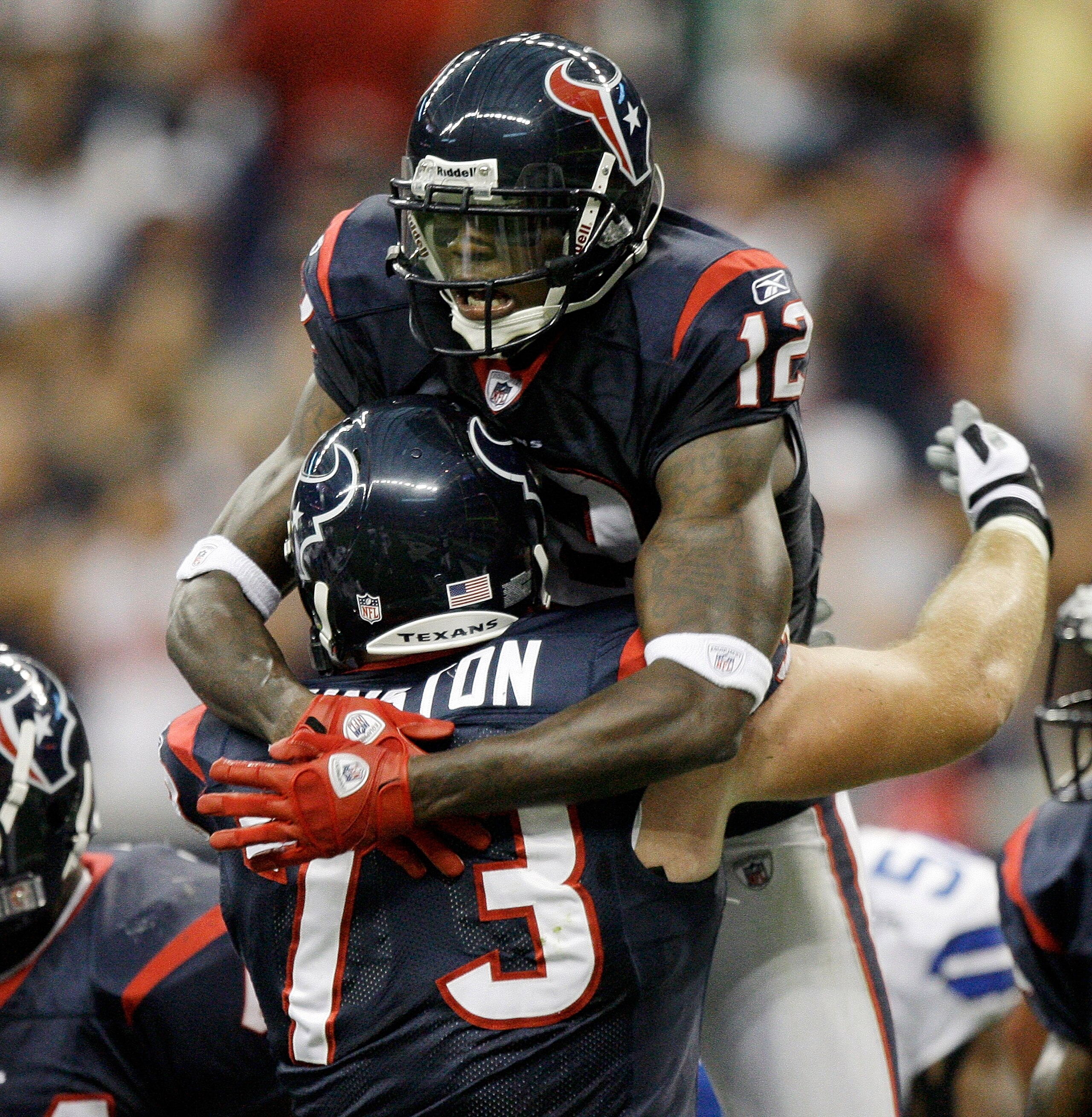 HOUSTON - AUGUST 28:  Wide receiver Jacoby Jones #12 of the Houston Texans celebrates his touchdown reception with Eric Winston #73 in the first quarter against the Dallas Cowboys in a preseason game at Reliant Stadium on August 28, 2010 in Houston, Texas