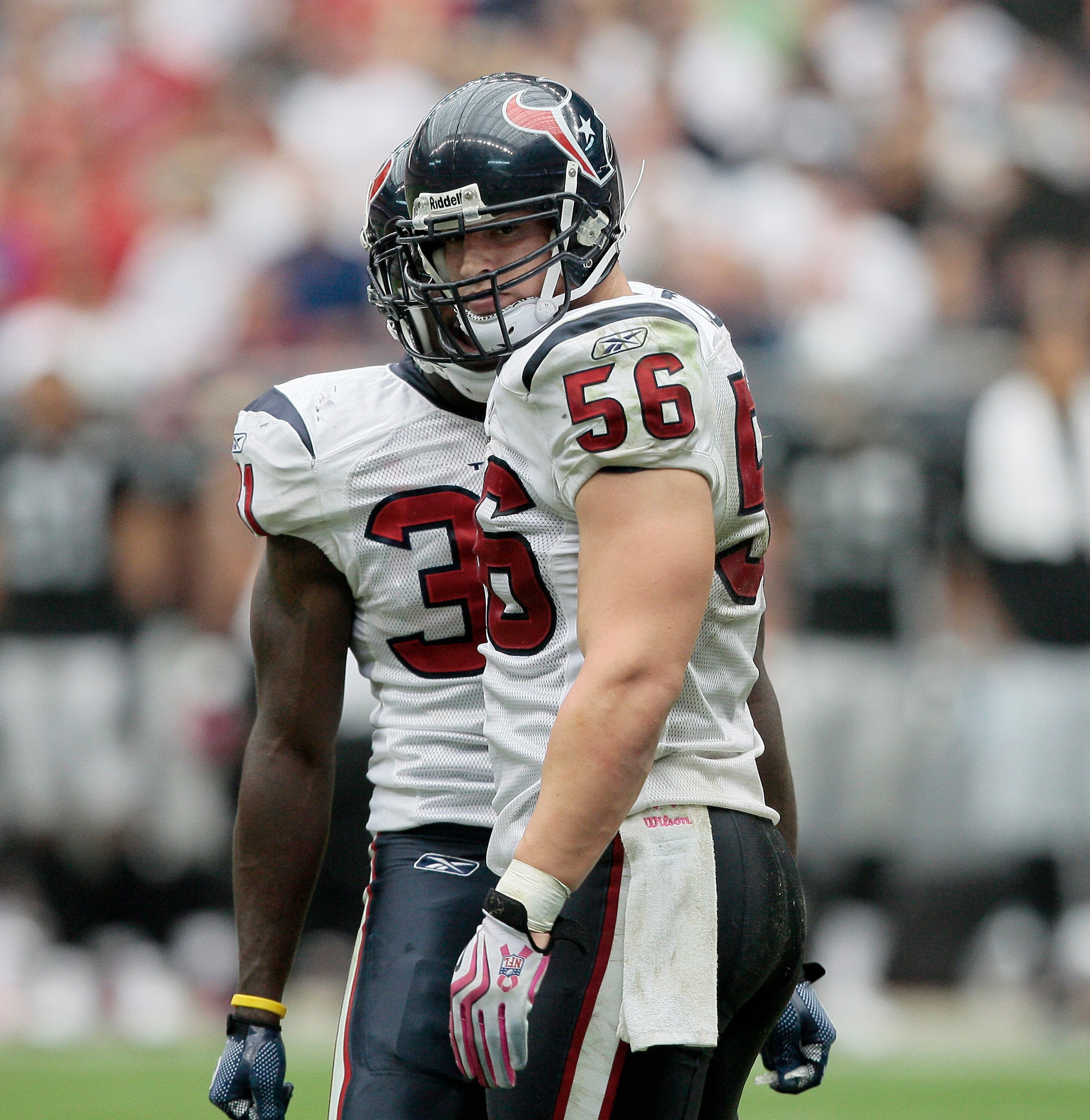 HOUSTON - OCTOBER 04:  Linebacker Brian Cushing #56 of the Houston Texans looks back at tight-end Zach Miller of her Oakland Raiders after delivering a hard hit in the fourth quarter at Reliant Stadium on October 4, 2009 in Houston, Texas.  (Photo by Bob