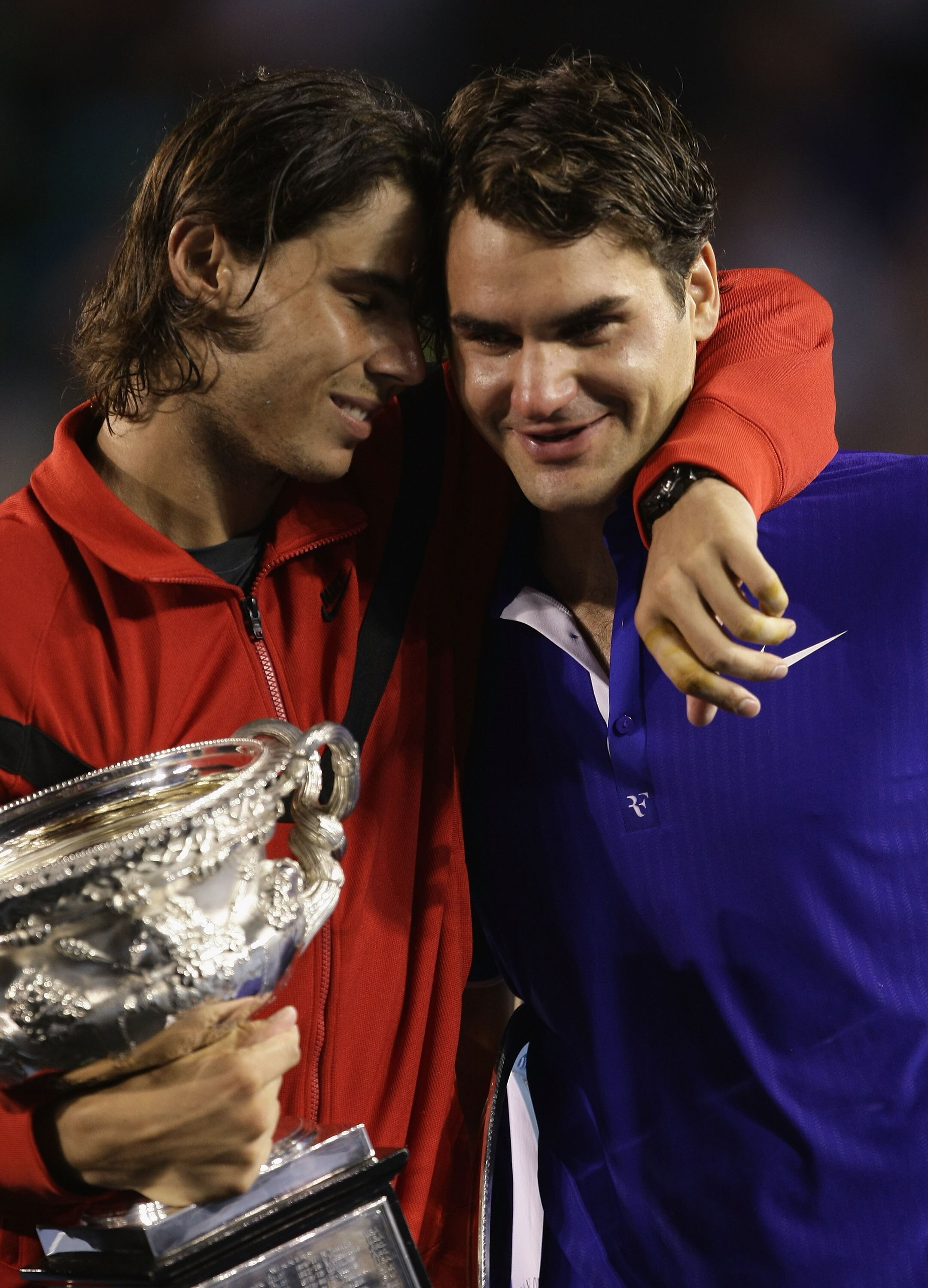 MELBOURNE, AUSTRALIA - FEBRUARY 01:  Rafael Nadal of Spain consoles Roger Federer of Switzerland during the trophy presentation after his men's final match during day fourteen of the 2009 Australian Open at Melbourne Park on  February 1, 2009 in Melbourne