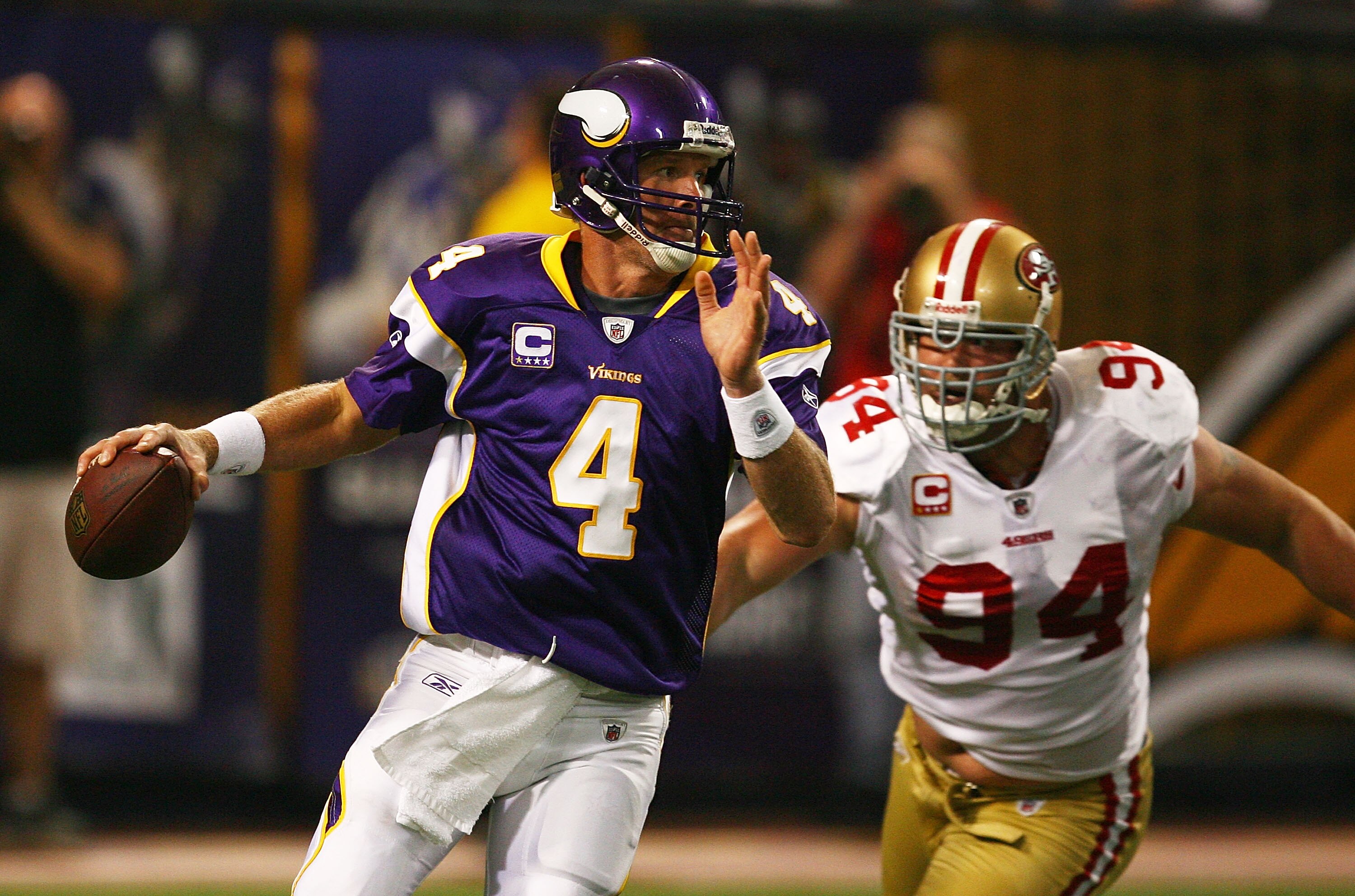 MINNEAPOLIS - SEPTEMBER 27: Brett Favre #4 of the Minnesota Vikings is chased out of the pocket by Pat Williams #94 of the San Francisco 49ers at the Hubert H. Humphrey Metrodome on September 27, 2009 in Minneapolis, Minnesota. (Photo by Jonathan Daniel/G