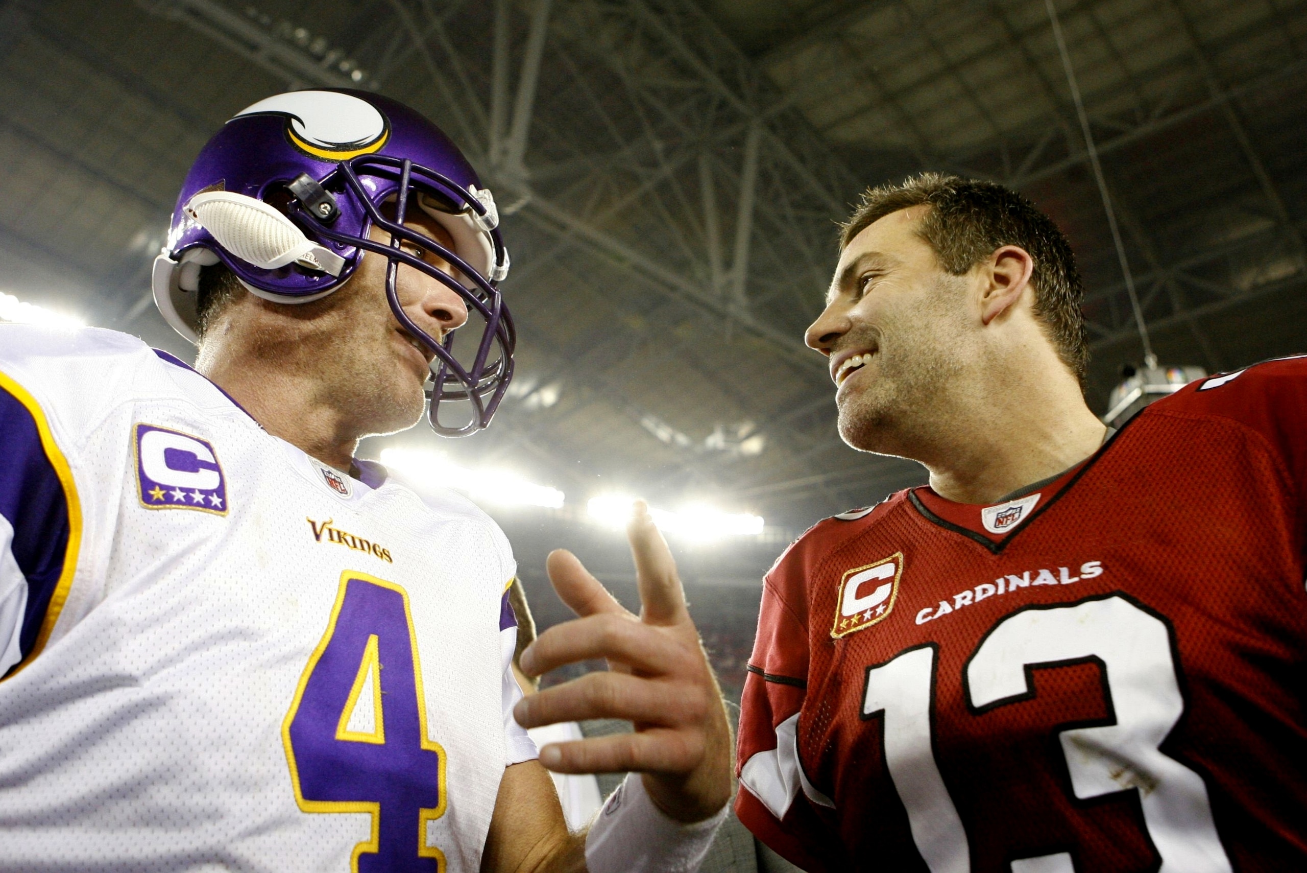 GLENDALE, AZ - DECEMBER 6: Quarterback Brett Favre #4 of the Minnesota Vikings greets quarterback Kurt Warner #13 of the Arizona Cardinals after the game at University of Phoenix Stadium on December 6, 2009 in Glendale, Arizona. The Cardinals won 30-17.  