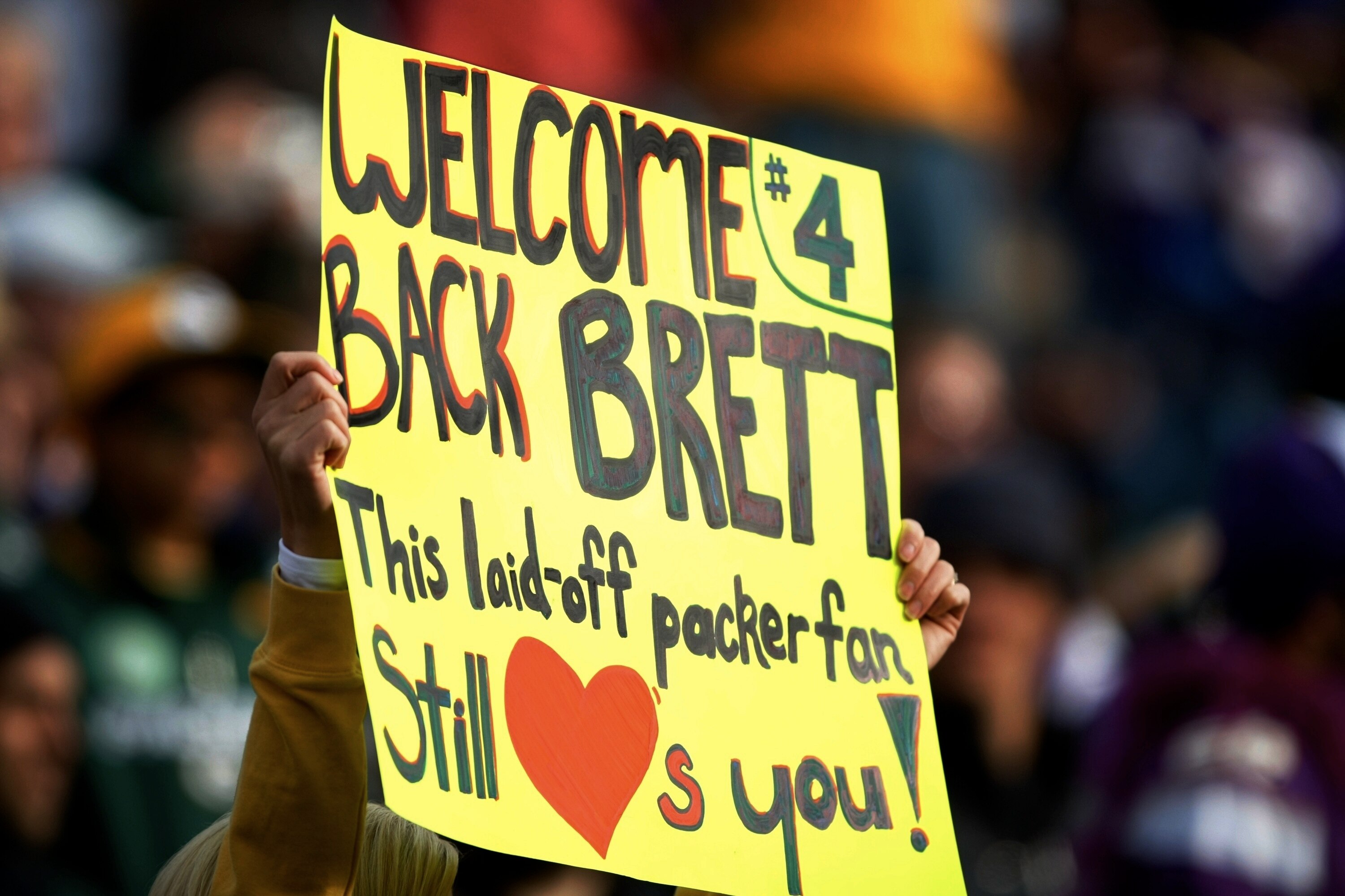 GREEN BAY, WI - NOVEMBER 01:  A fan holds a sign in support of quarterback Brett Favre #4 of the Minnesota Vikings before the game against the Green Bay Packers at Lambeau Field on November 1, 2009 in Green Bay, Wisconsin. (Photo by Scott Boehm/Getty Imag