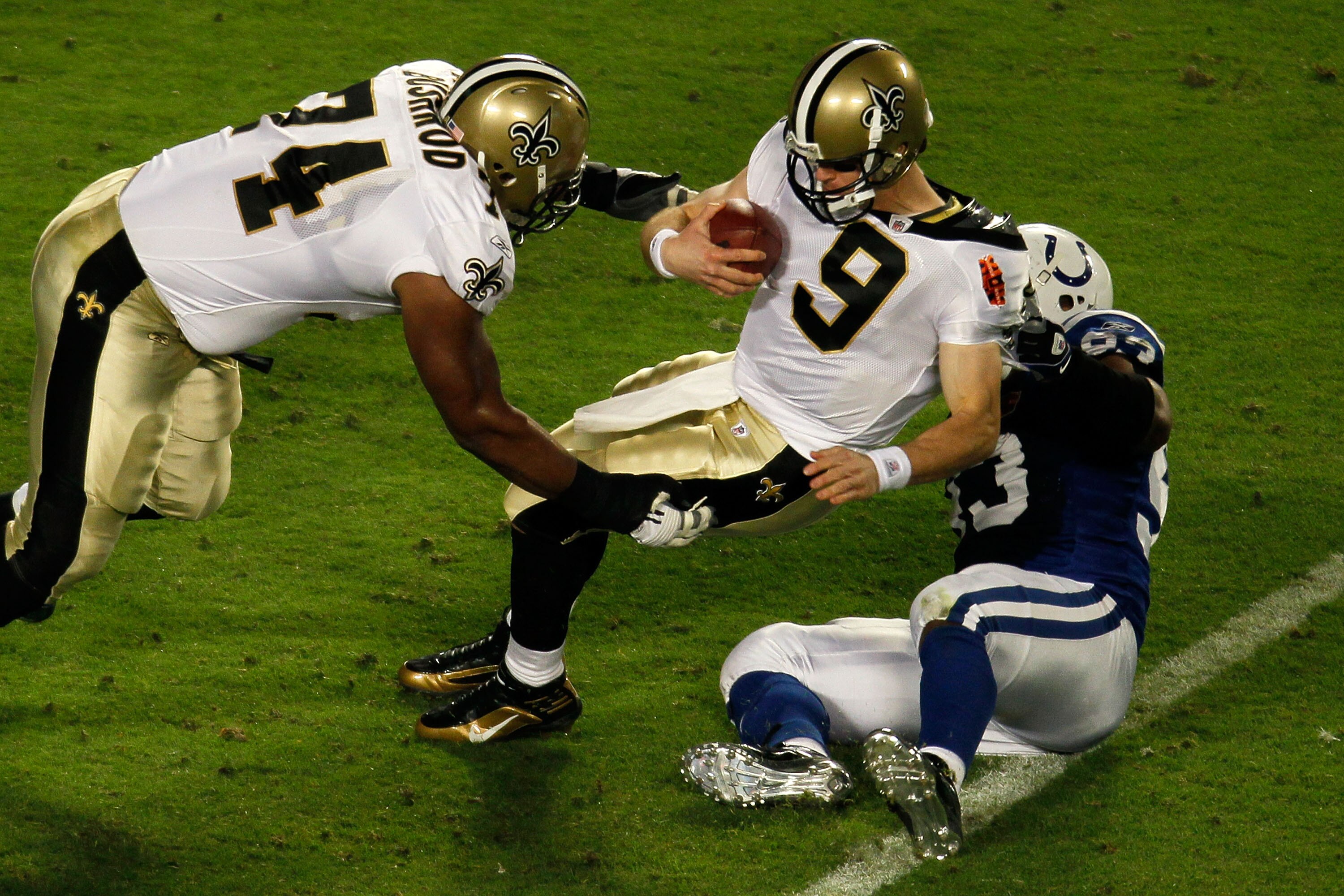 MIAMI GARDENS, FL - FEBRUARY 07:  Dwight Freeney #93 of the Indianapolis Colts sacks Drew Brees #9 of the New Orleans Saints during Super Bowl XLIV on February 7, 2010 at Sun Life Stadium in Miami Gardens, Florida.  (Photo by Doug Benc/Getty Images)