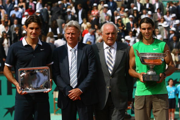 PARIS - JUNE 08:  Roger Federer of Switzerland, Bjorn Borg of Sweden, Christian Bimes of the FFT and Rafael Nadal of Spain pose for photos after the final match between  during the Men's Singles Final match on day fifteen of the French Open at Roland Garr
