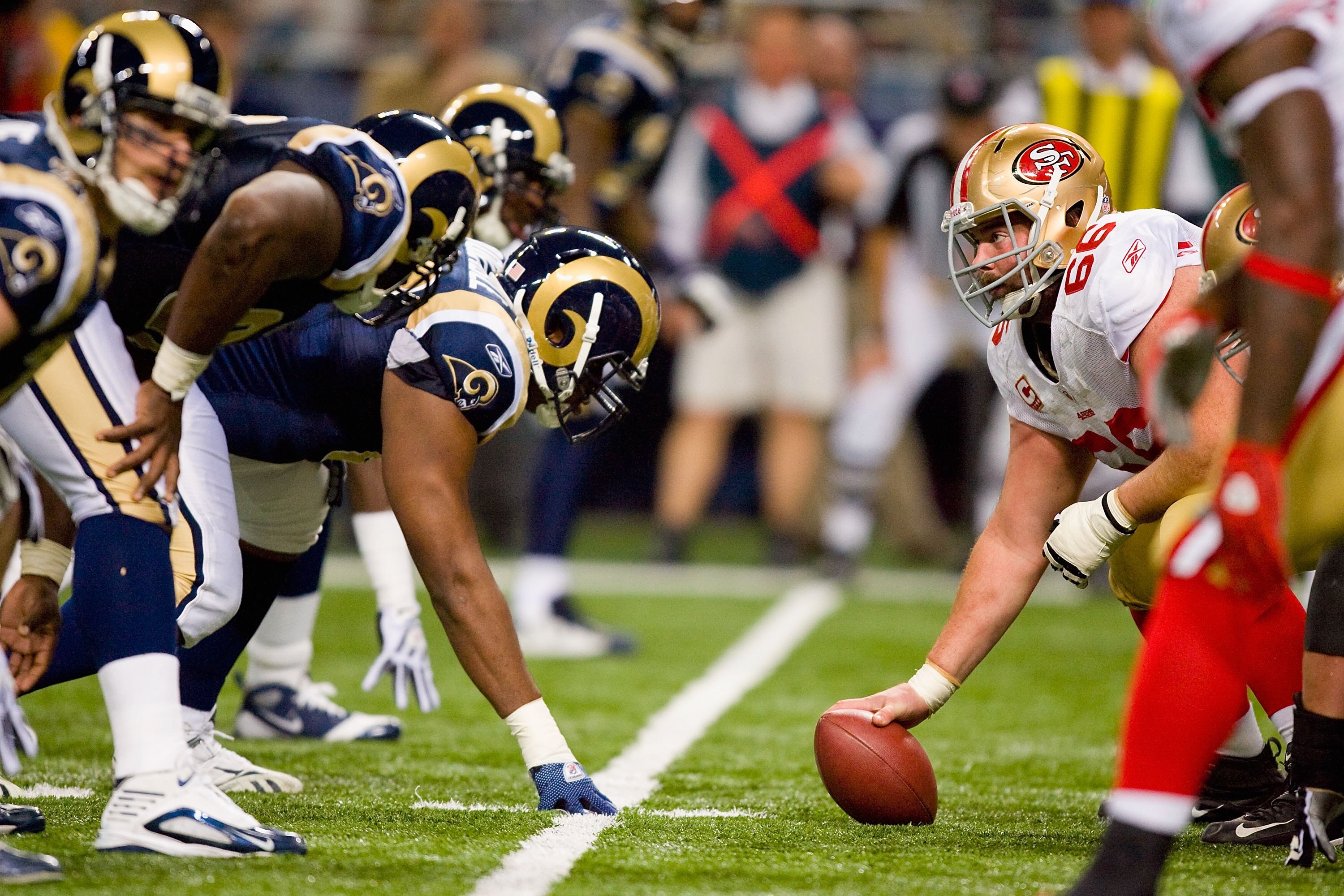 ST. LOUIS - JANUARY 3:  Center Eric Heitmann #66 of the San Francisco 49ers gets ready to hike the ball during the game against the St. Louis Rams at the Edward Jones Dome on January 3, 2010 in St. Louis, Missouri.  The 49ers beat the Rams 28-6.  (Photo b