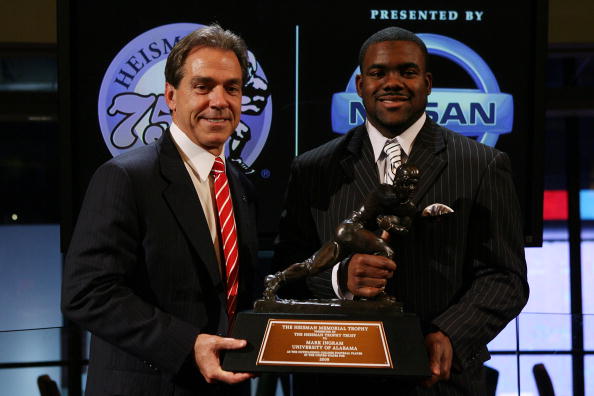 NEW YORK - DECEMBER 12: Running back Mark Ingram (R) #22 of the Alabama Crimson Tide poses with Head coach Nick Saban (L) and the Heisman Trophy during a press conference after being named the 75th Heisman Trophy winner at the Marriott Marquis on December