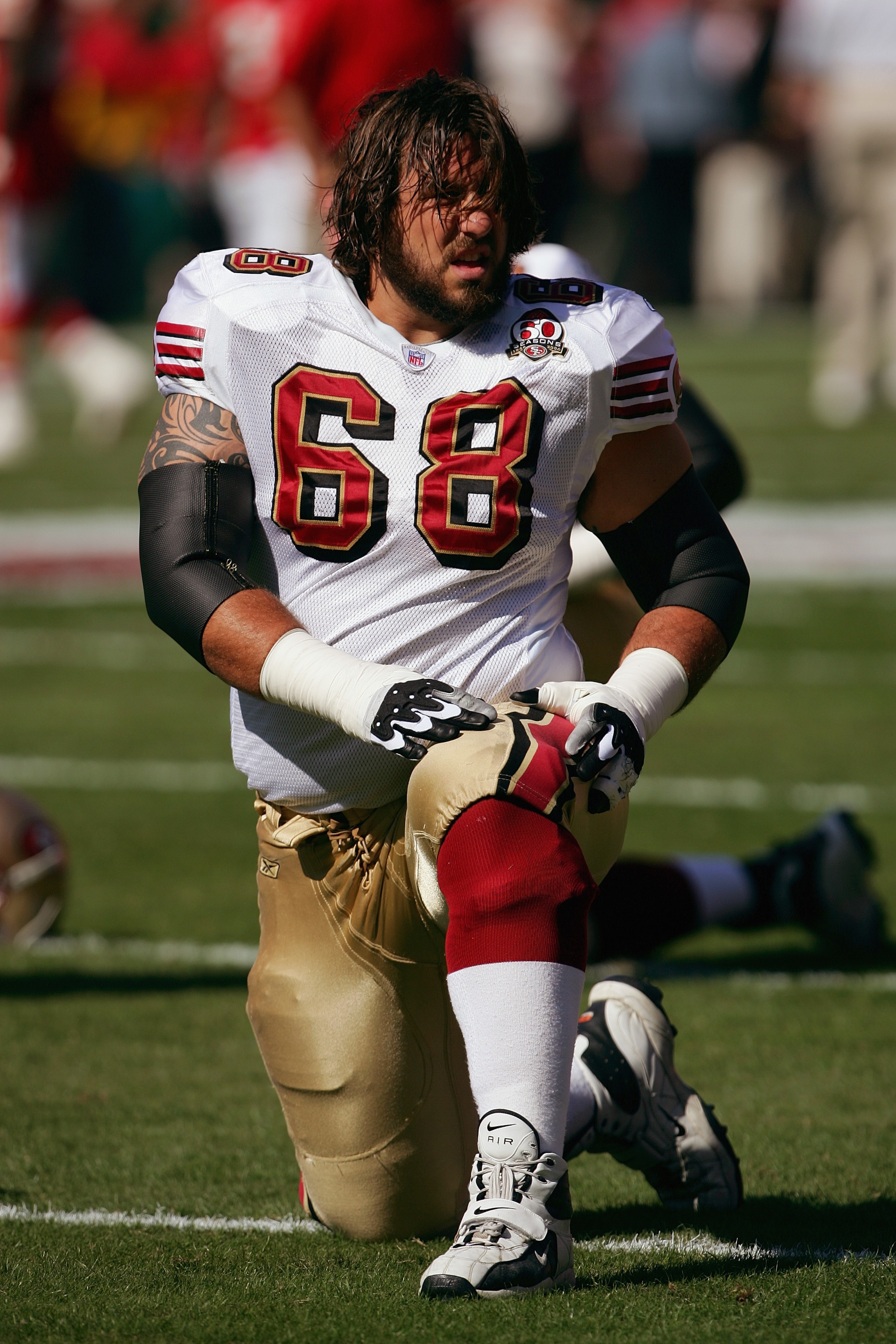 KANSAS CITY, MO - OCTOBER 1:  Offensive guard Adam Snyder #68 of the San Francisco 49ers stretches before the game against the Kansas City Chiefs at Arrowhead Stadium on October 1, 2006 in Kansas City, Missouri. The Chiefs defeated the Niners 41-0.  (Phot