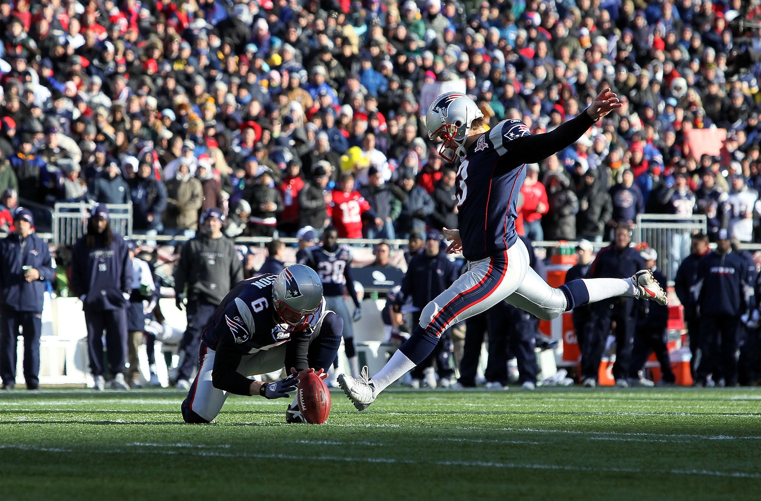 FOXBORO, MA - JANUARY 10:  Kicker Steve Gostkowski #3 of the New England Patriots attempts a kick from the hold of Chris Hanson #6 against the Baltimore Ravens during the 2010 AFC wild-card playoff game at Gillette Stadium on January 10, 2010 in Foxboro, 