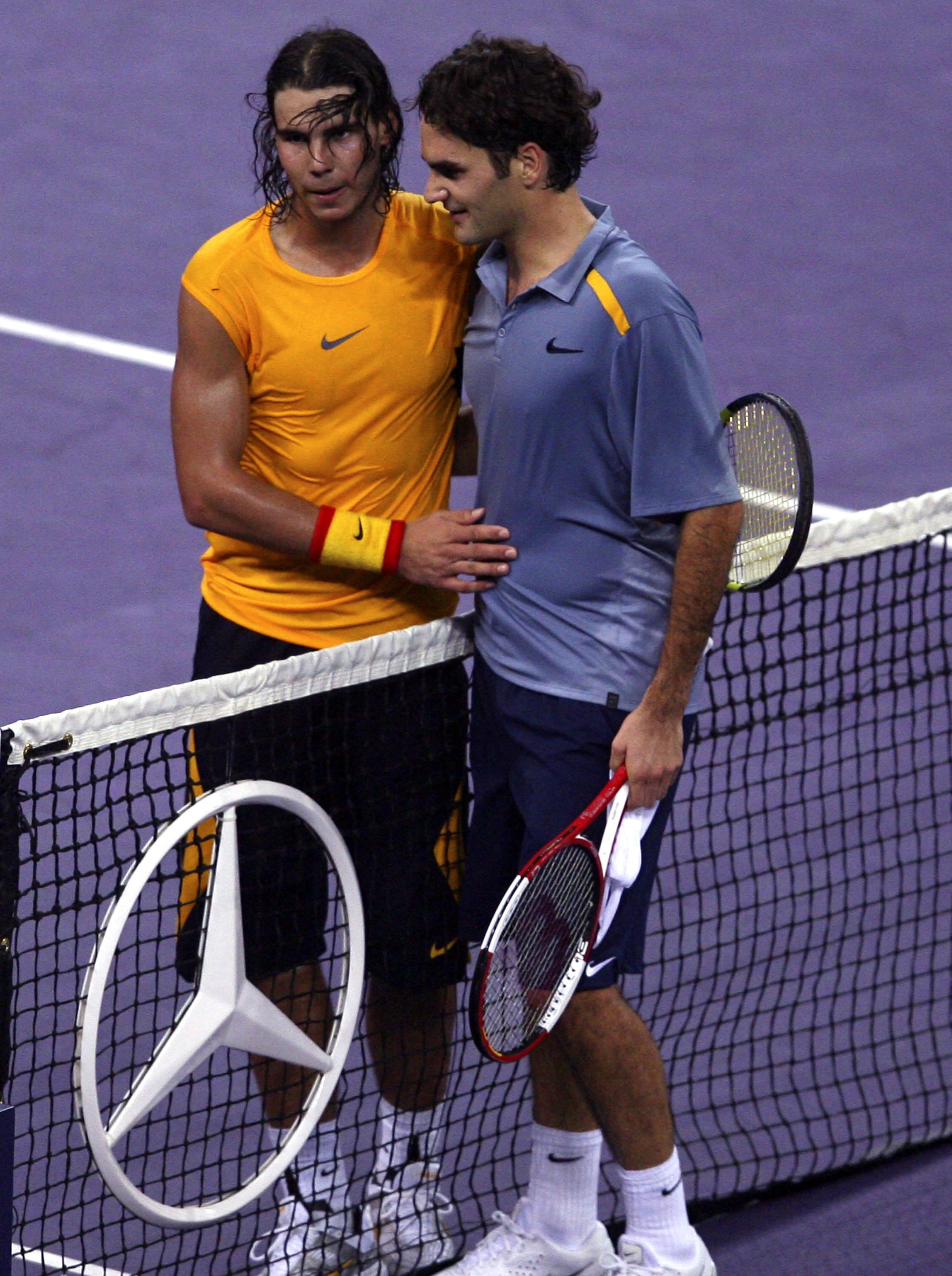SHANGHAI, CHINA - NOVEMBER 18: (CHINA OUT) Roger Federer (R) of Switzerland and Rafael Nadal of Spain shake hands after their semi-finals of the Tennis Masters Cup Shanghai on November 18, 2006 at the Qi Zhong Tennis Stadium in Shanghai, China. (Photo by