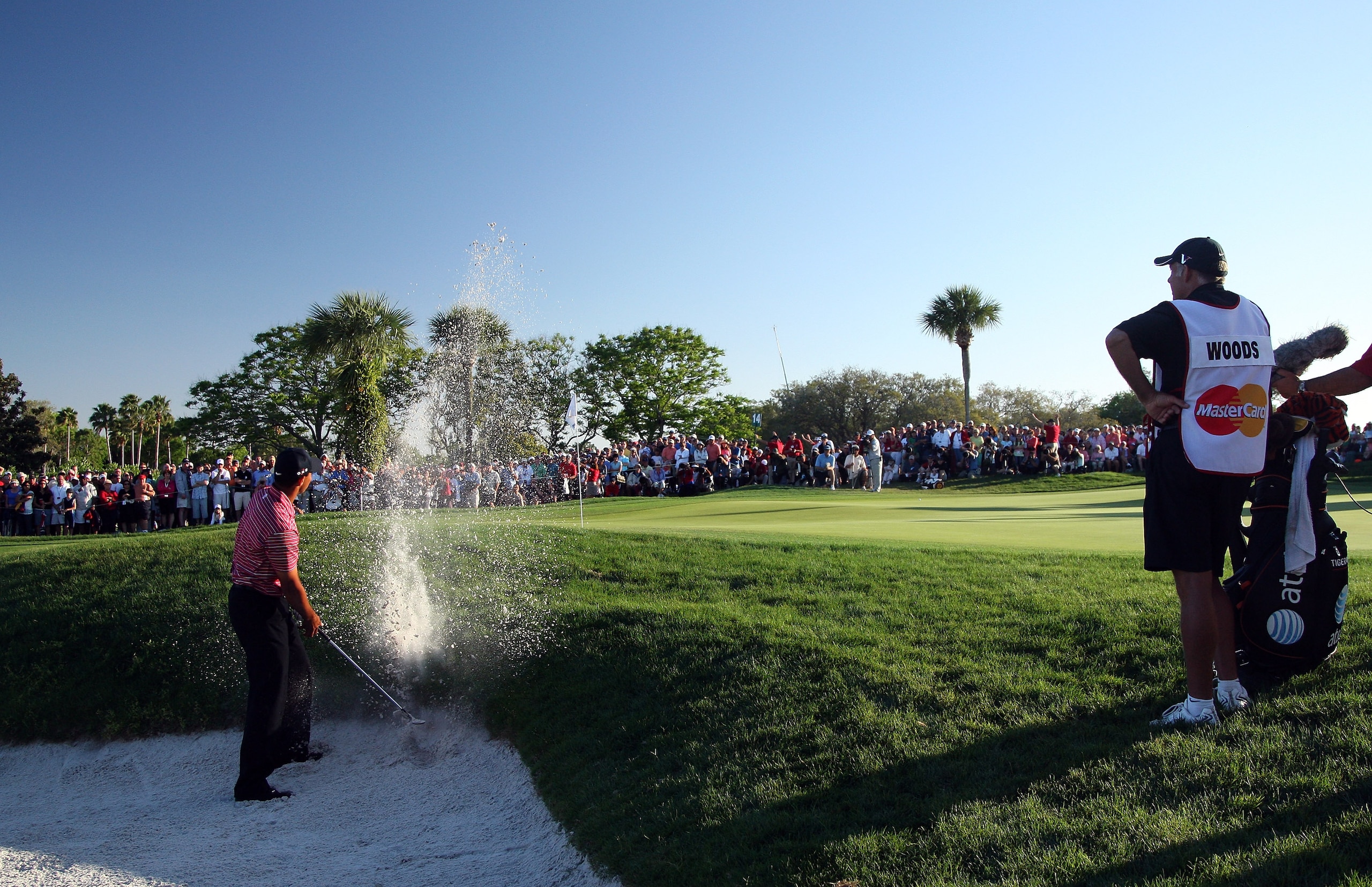 ORLANDO, FL - MARCH 29:  Tiger Woods of the USA plays his second shot from a plugged lie in the bunker at the 14th hole during the final round of the Arnold Palmer Invitational Presented by Mastercard at the Bay Hill Club and Lodge on March 29, 2009 in Or