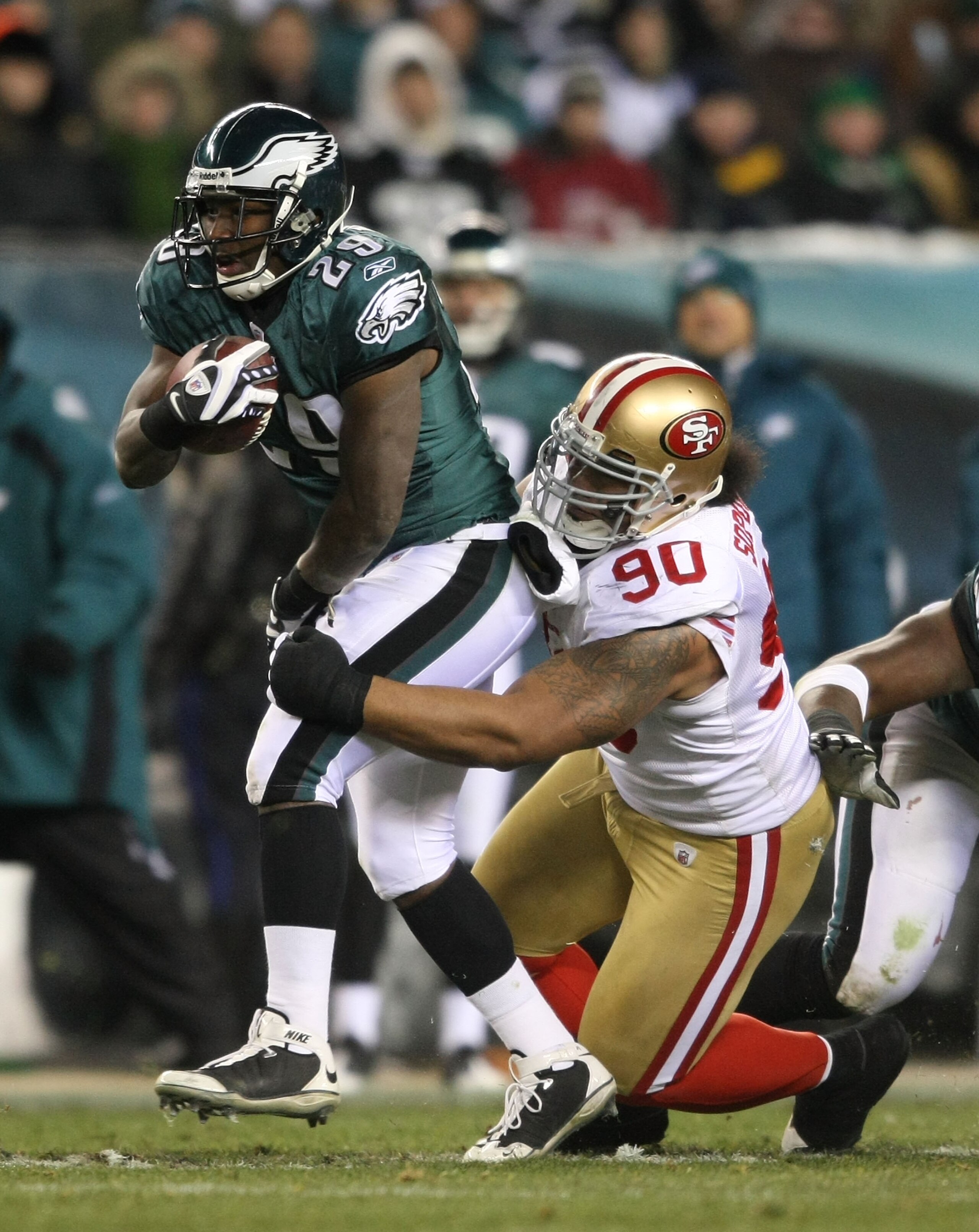 PHILADELPHIA - DECEMBER 20: LeSean McCoy #29 of the Philadelphia Eagles is tackled by Isaac Sopaga #90 of the San Francisco 49ers at Lincoln Financial Field on December 20, 2009 in Philadelphia, Pennsylvania.  (Photo by Nick Laham/Getty Images)