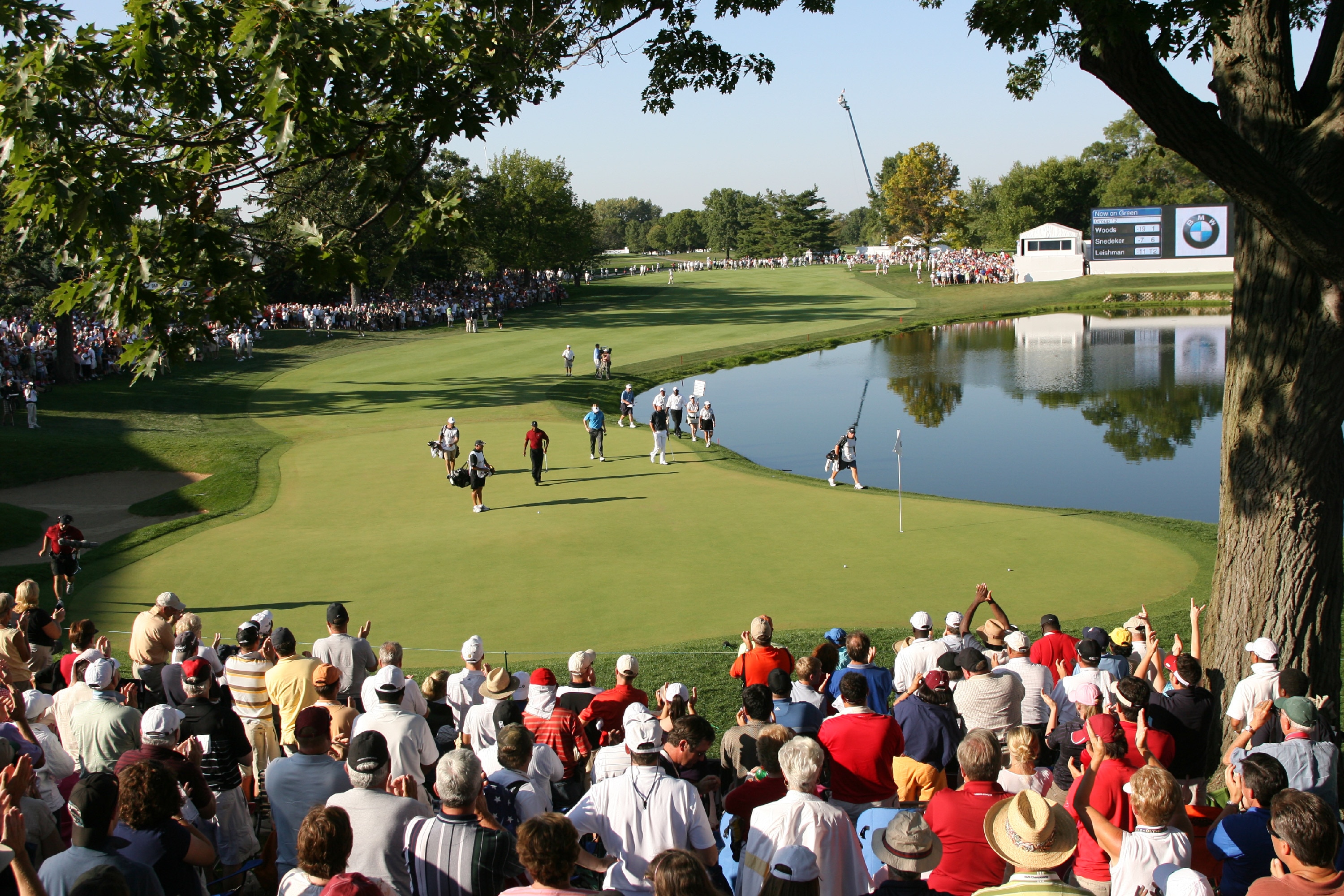 LEMONT, IL - SEPTEMBER 13: The group of Tiger Woods, Brandt Snedeker, and Marc Leishman walk onto the 18th green during the final round the BMW Championship at Cog Hill Golf & Country Club on September 13, 2009 in Lemont, Illinois. (Photo by Hunter Martin