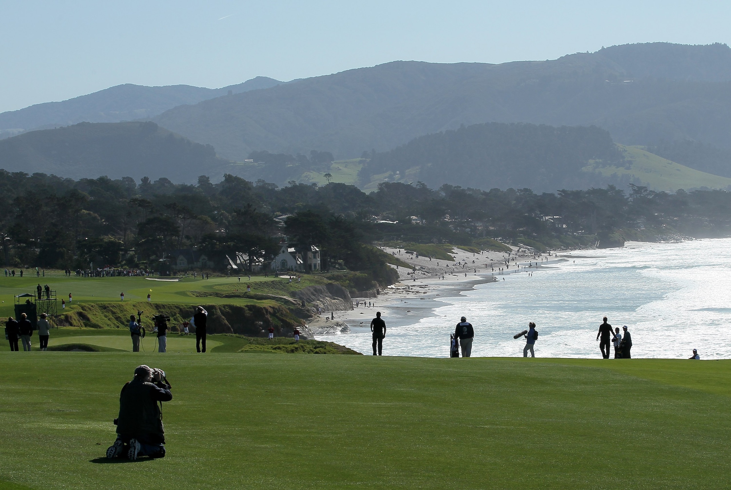 PEBBLE BEACH, CA - FEBRUARY 14:  A photographer lines up a shot on the ninth hole during the final round of the AT&T Pebble Beach National Pro-Am at Pebble Beach Golf Links on February 14, 2010 in Pebble Beach, California.  (Photo by Stephen Dunn/Getty Im