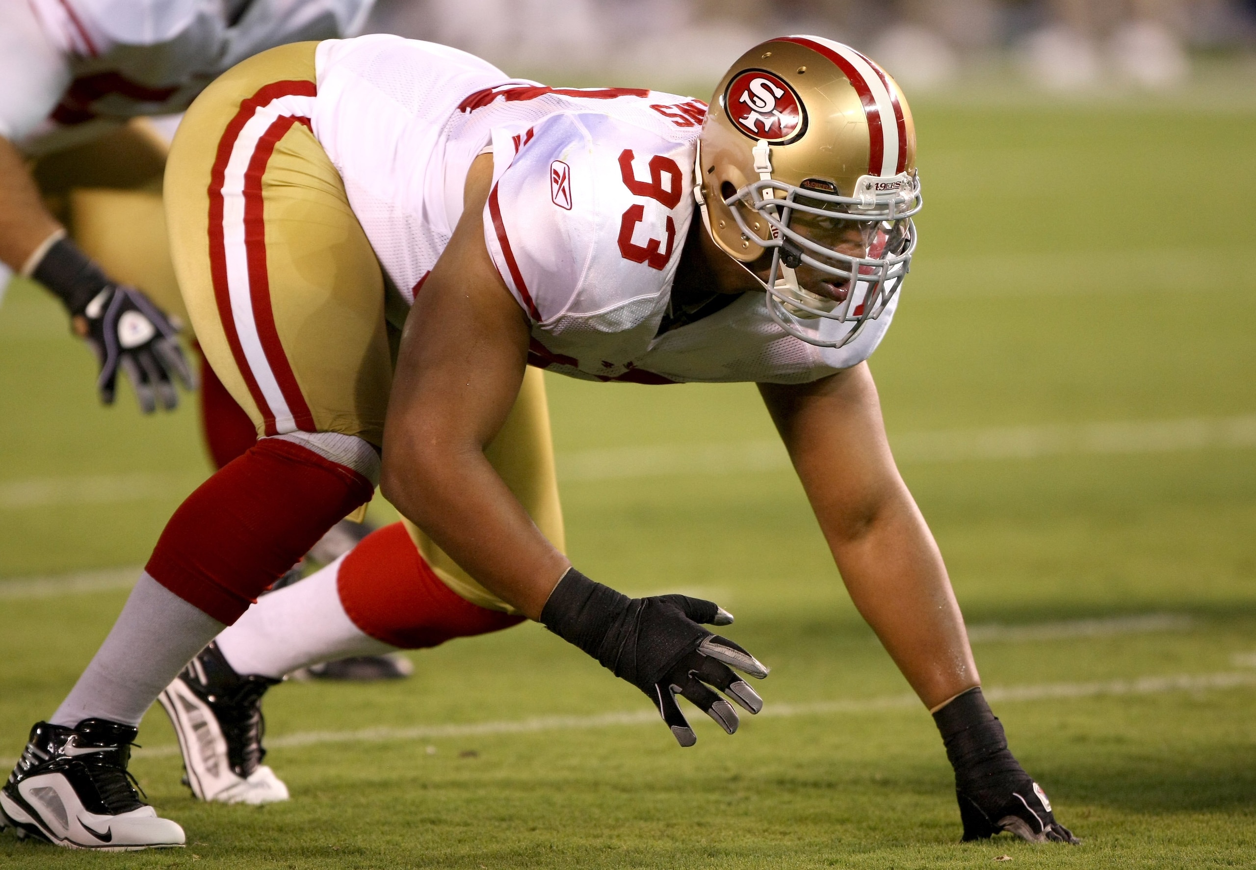 SAN DIEGO - SEPTEMBER 04:  Defensive end Demetric Evans #93 of the San Francisco 49ers sets on the line against the San Diego Chargers on September 4, 2009 at Qualcomm Stadium in San Diego, California.  The Chargers won 26-7. (Photo by Stephen Dunn/Getty 