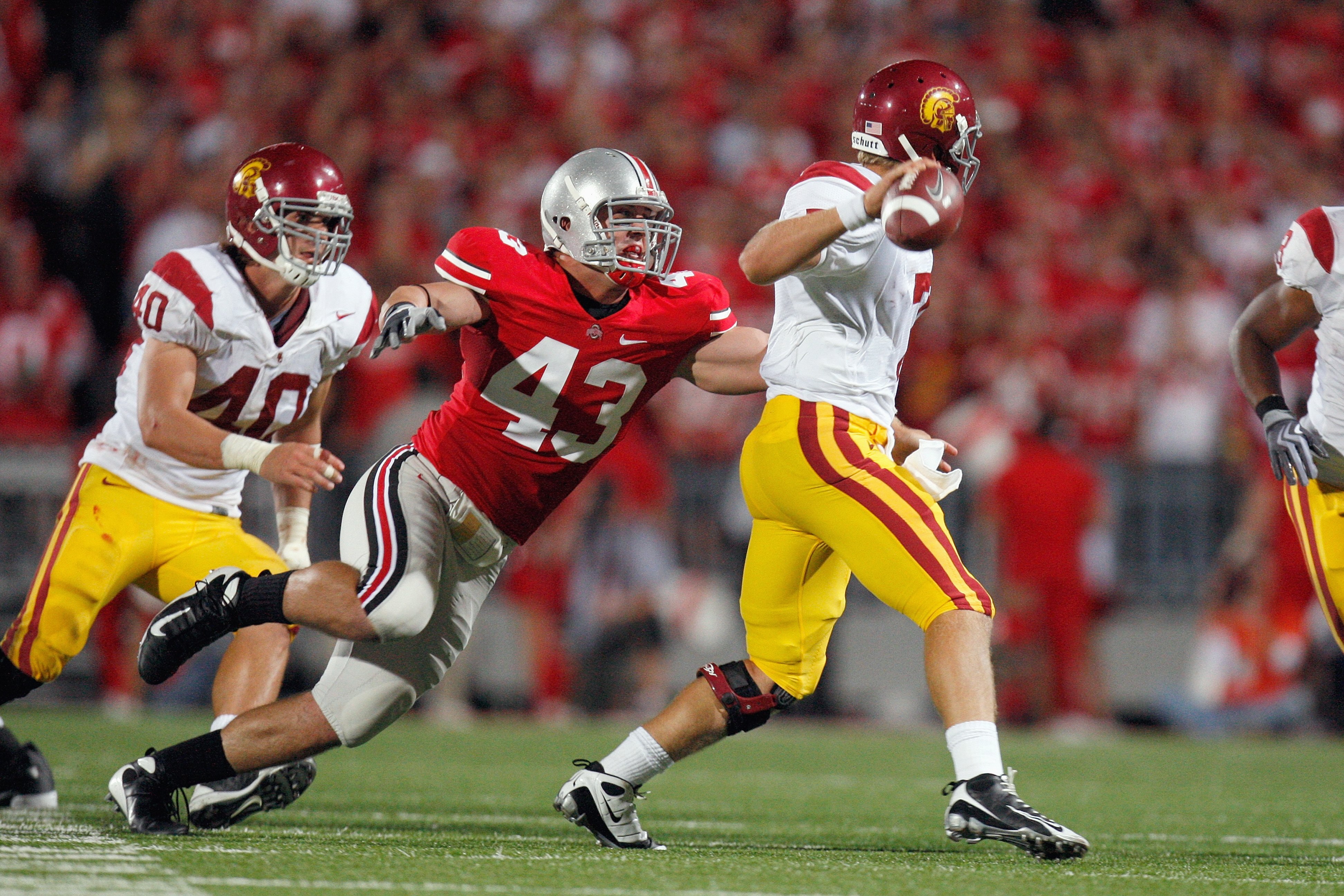 COLUMBUS, OH - SEPTEMBER 12:  Nathan Williams #43 of the Ohio State Buckeyes moves to sack quarterabck Matt Barkley #7 during the game against the Southern California Trojans on September 12, 2009 at Ohio Stadium in Columbus, Ohio. The Trojans defeated th