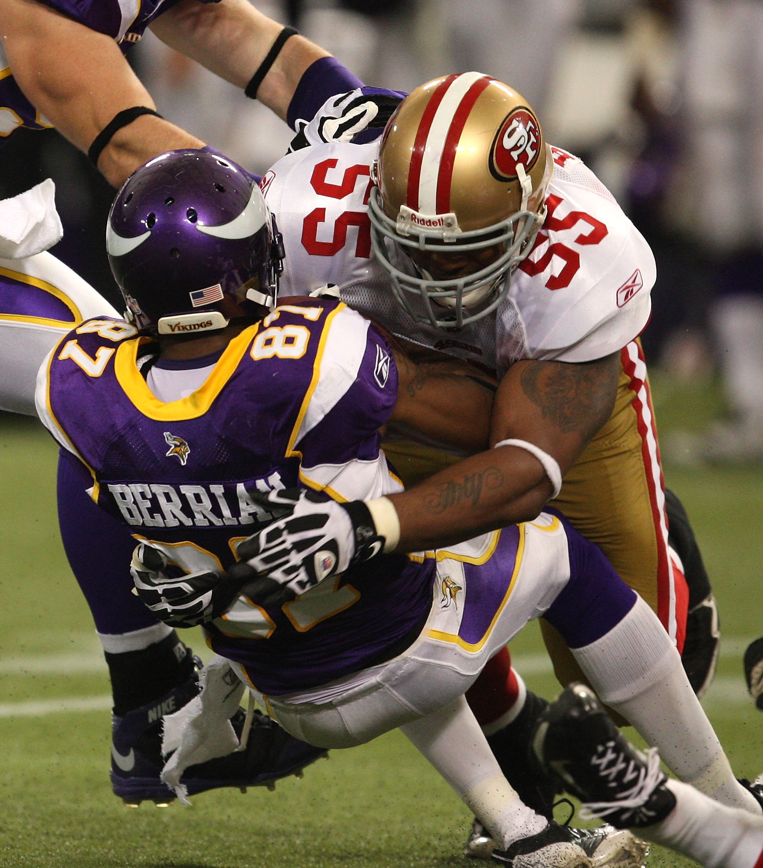 MINNEAPOLIS - SEPTEMBER 27: Ahmad Brooks #55 of the San Francisco 49ers tackles Bernard Berrian #87 of the Minnesota Vikings at the Hubert H. Humphrey Metrodome on September 27, 2009 in Minneapolis, Minnesota. The Vikings defeated the 49ers 27-24. (Photo 