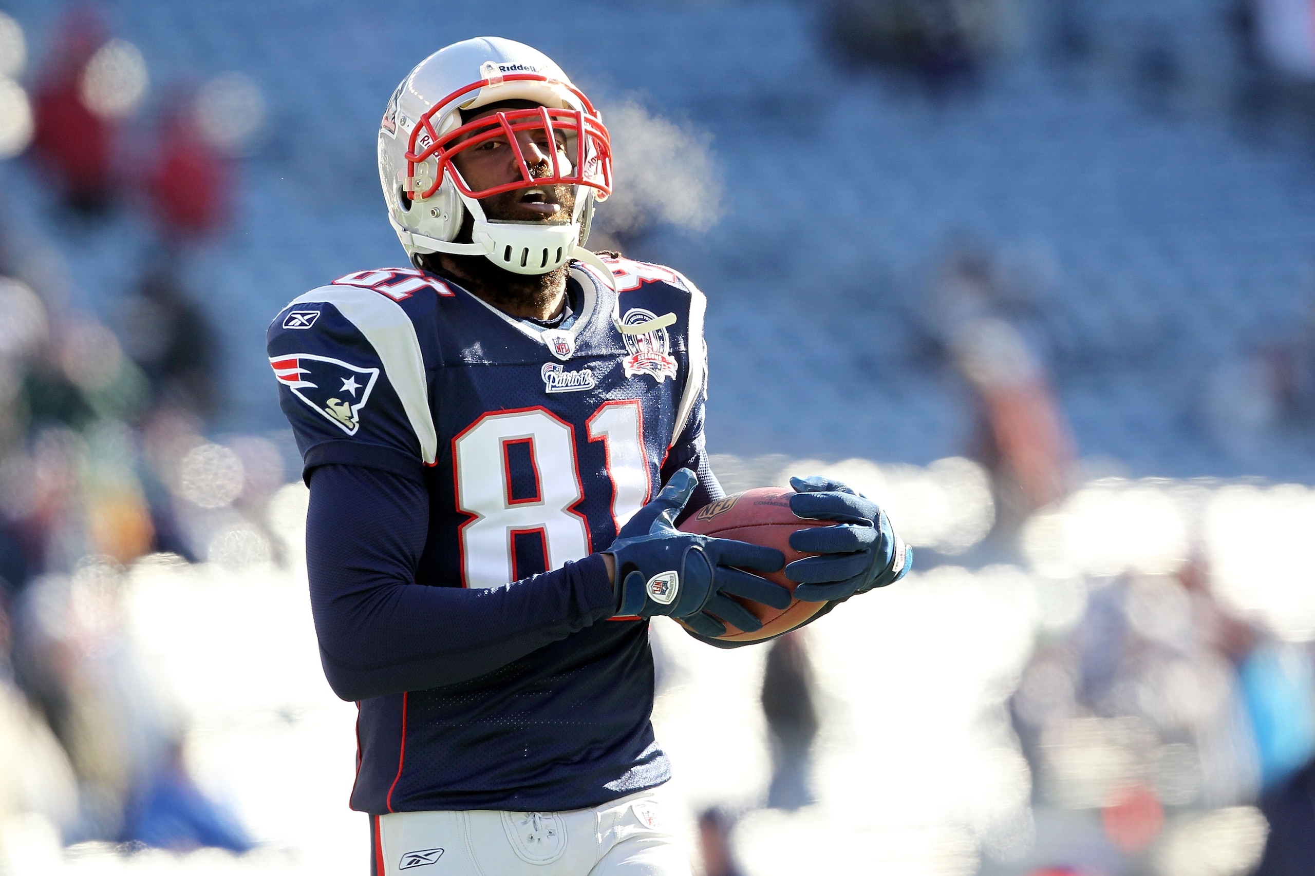FOXBORO, MA - JANUARY 10: Randy Moss #81 of the New England Patriots looks on during warm ups against the Baltimore Ravens during the 2010 AFC wild-card playoff game at Gillette Stadium on January 10, 2010 in Foxboro, Massachusetts. (Photo by Jim Rogash FOXBORO, MA - JANUARY 10: Randy Moss #81 of the New England Patriots looks on during warm ups against the Baltimore Ravens during the 2010 AFC wild-card playoff game at Gillette Stadium on January 10, 2010 in Foxboro, Massachusetts. (Photo by Jim Rogash