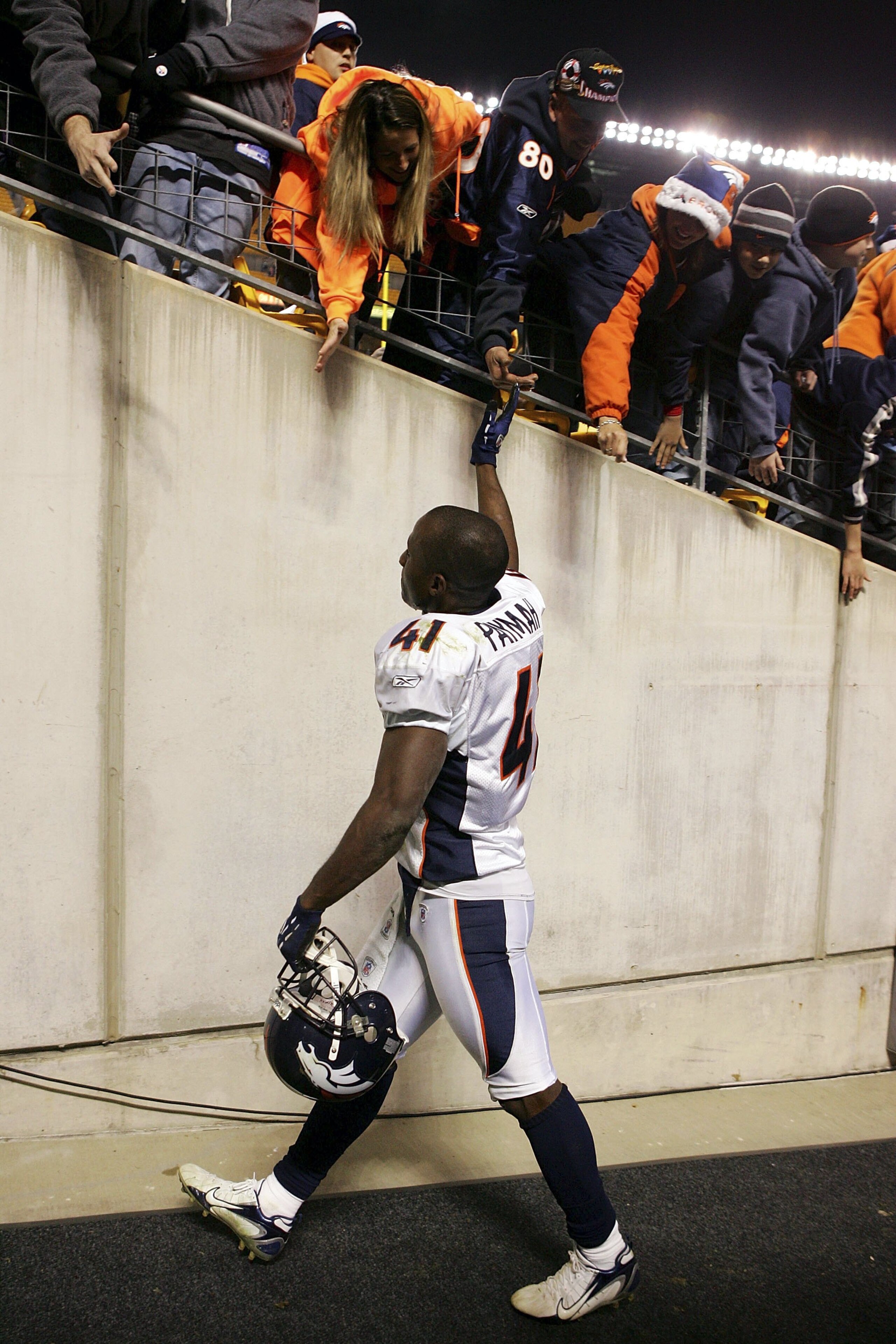 PITTSBURGH - NOVEMBER 05:  Karl Paymah #41 of the Denver Broncos celebrates his teams 31-20 victory against the Pittsburgh Steelers with fans on November 5, 2006 at Heinz Field in Pittsburgh, Pennsylvania.  (Photo by Jim McIsaac/Getty Images)