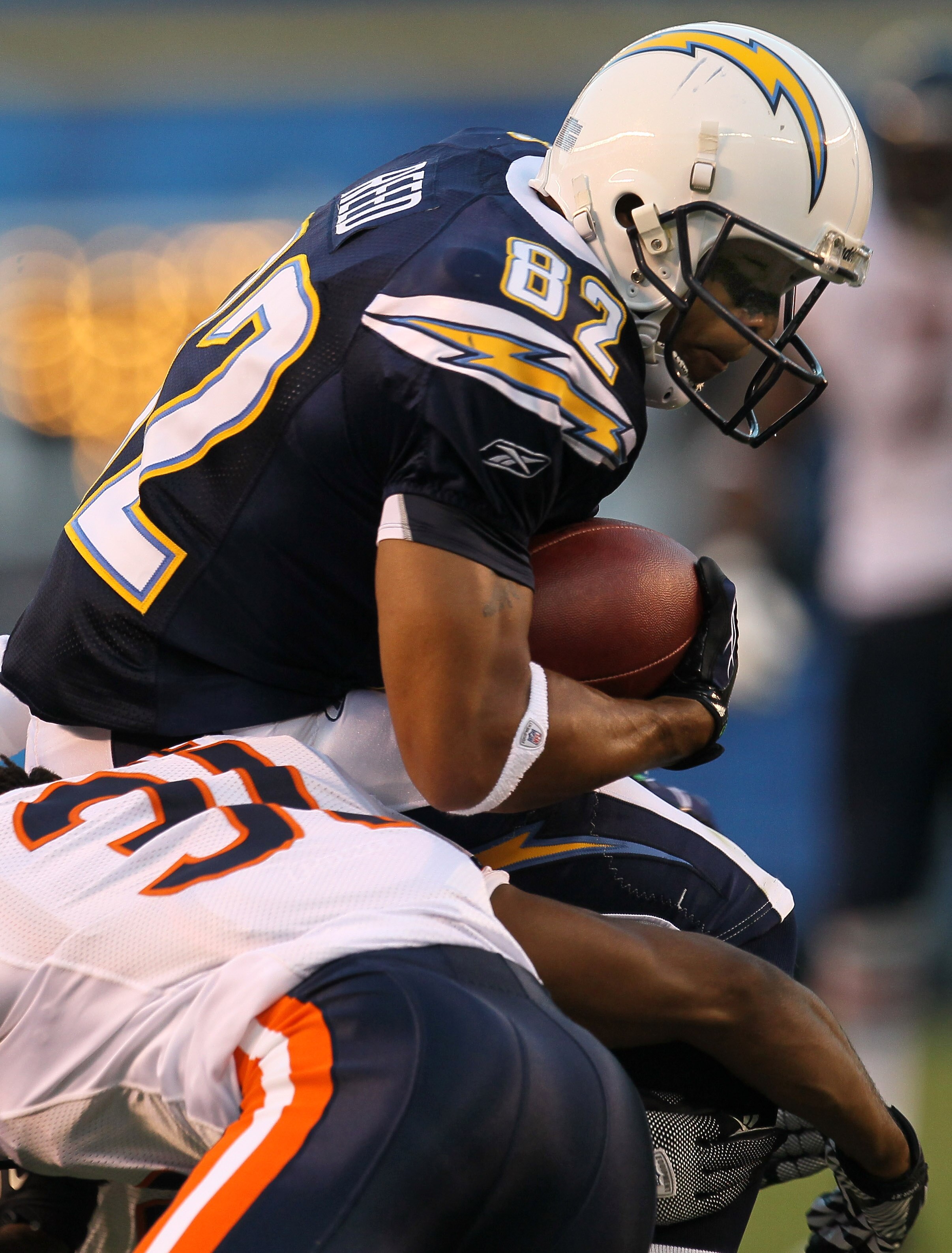 SAN DIEGO - AUGUST 14:   Wide receiver Josh Reed #82 of the San Diego Chargers carries the ball against the Chicago Bears on August 14, 2010 at Qualcomm Stadium in San Diego, California.   (Photo by Stephen Dunn/Getty Images)