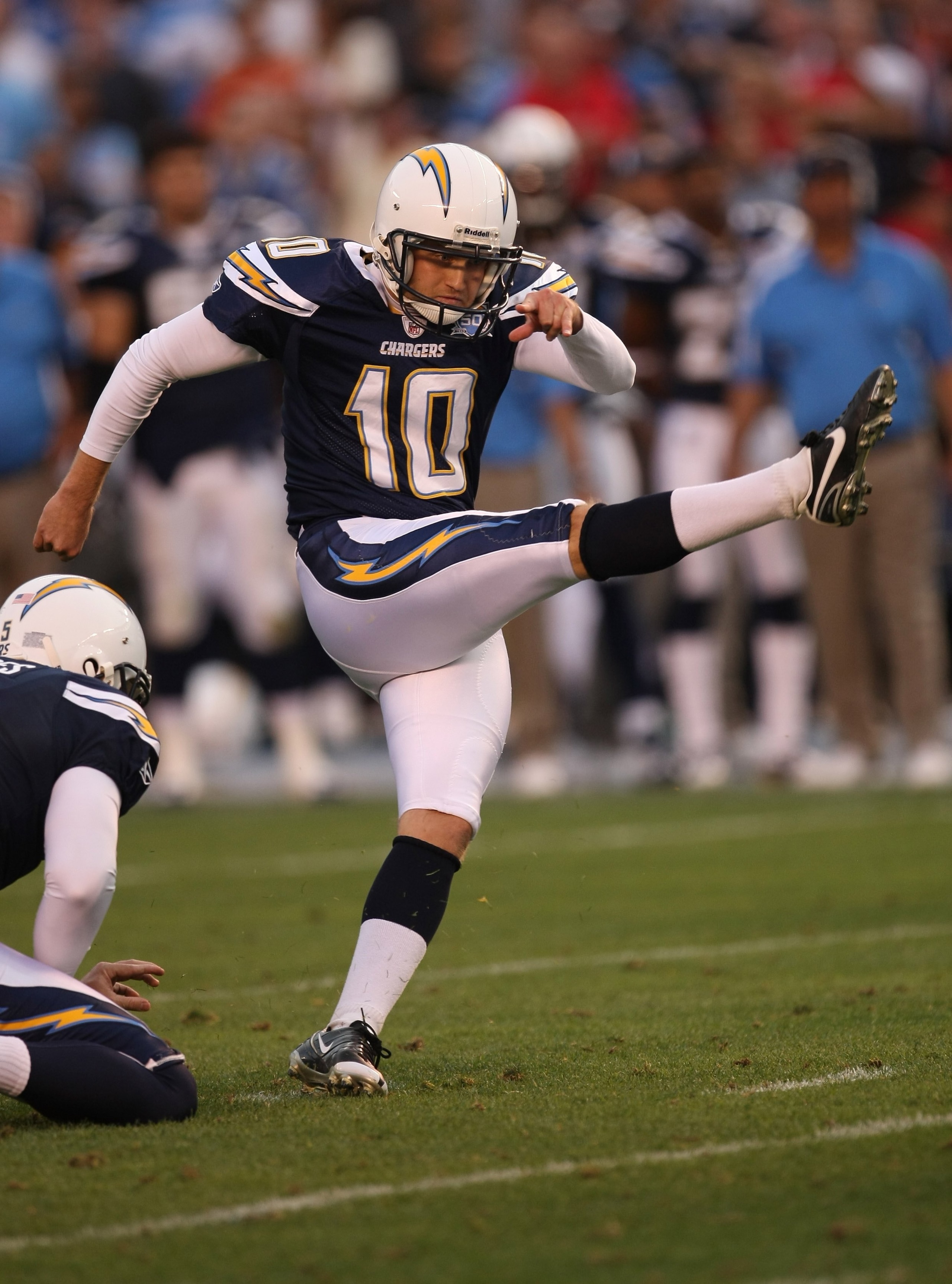 SAN DIEGO - DECEMBER 20:  Nate Kaeding #10 of the San Diego Chargers kicks the game winning field goal with three seconds left in the game against the Cincinnati Bengals as Mike Scifres holds on December 20, 2009 at Qualcomm Stadium in San Diego, Californ