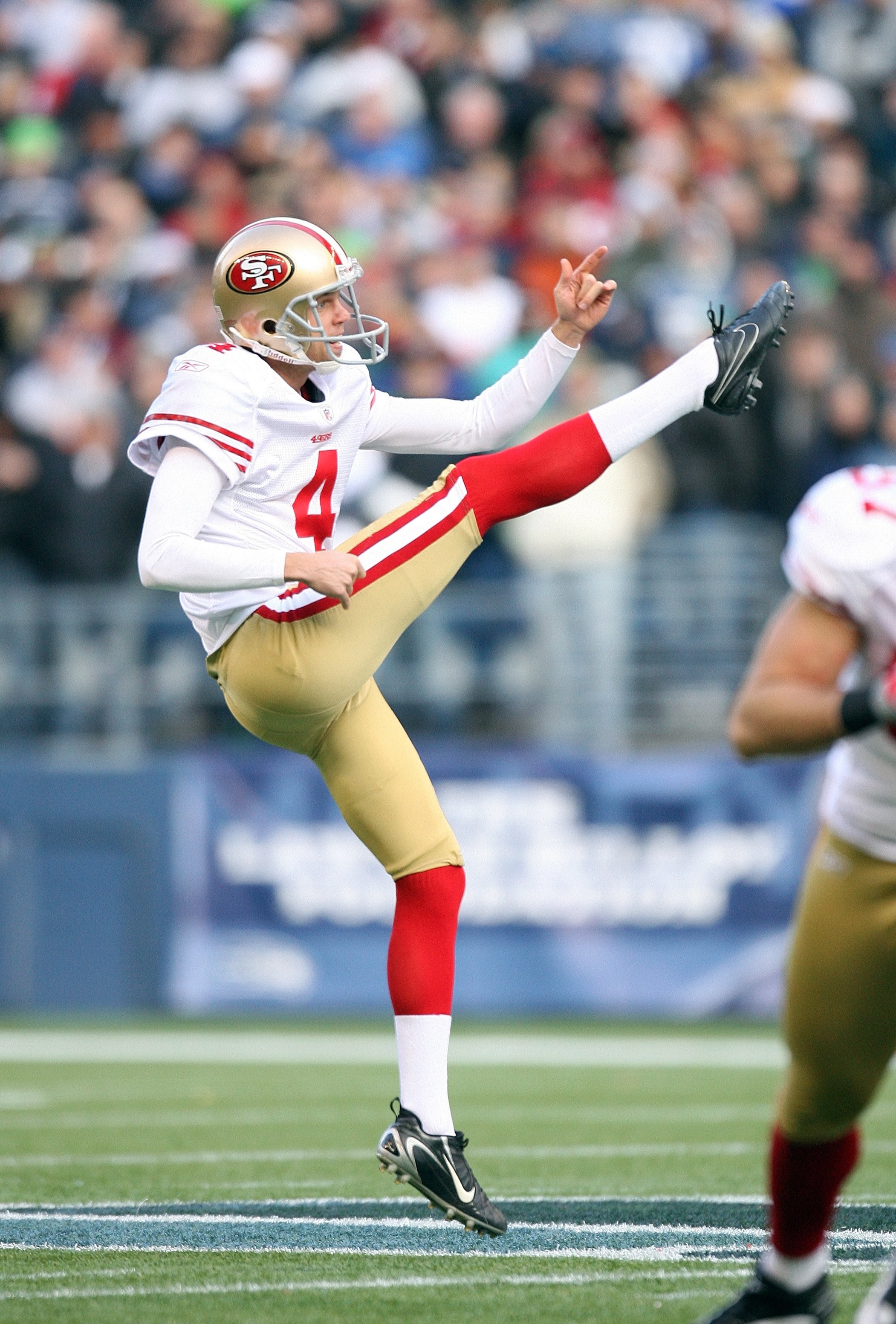 SEATTLE - DECEMBER 6:  Punter Andy Lee #4 of the San Francisco 49ers follows through on his kick during their NFL game against the Seattle Seahawks on December 6, 2009 at Qwest Field in Seattle, Washington. The Seahawks defeated the 49ers 20-17. (Photo by