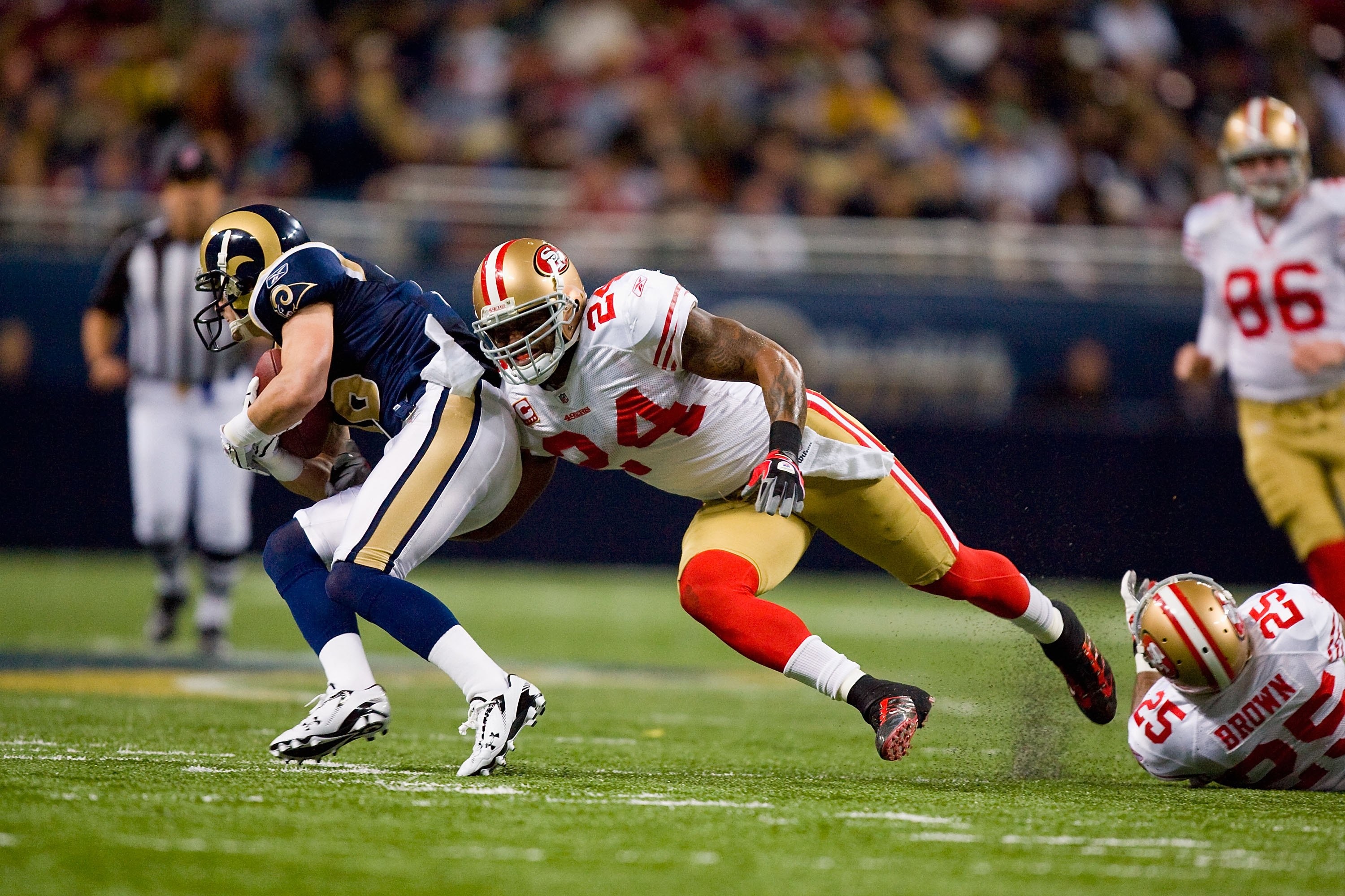 ST. LOUIS - JANUARY 3: Michael Robinson #24 of the San Francisco 49ers moves to tackle Danny Amendola #16 of the St. Louis Rams at the Edward Jones Dome on January 3, 2010 in St. Louis, Missouri.  The 49ers beat the Rams 28-6.  (Photo by Dilip Vishwanat/G