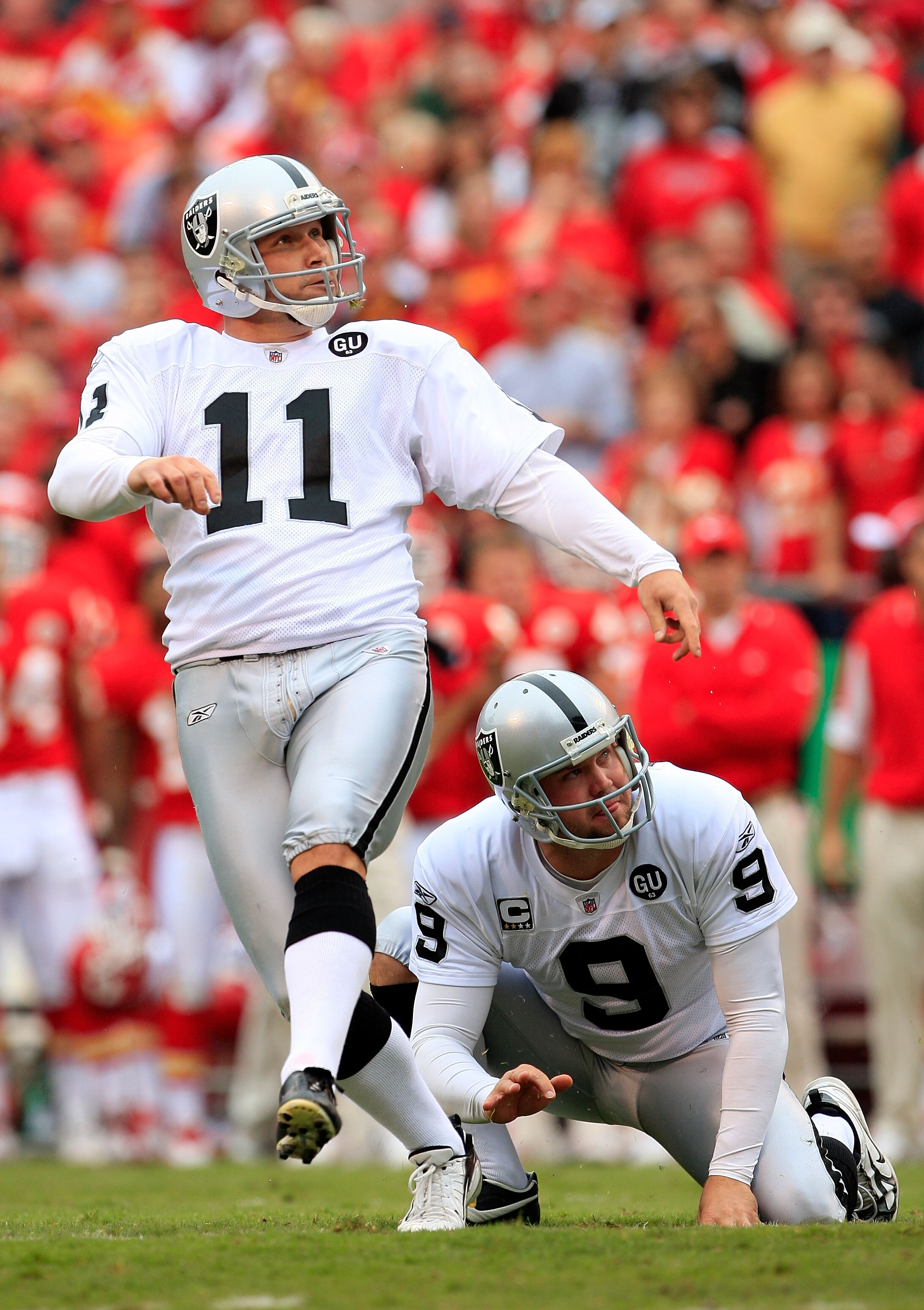 KANSAS CITY, MO - SEPTEMBER 14:  Kicker Sebastian Jankikowski #11 of the Oakland Raiders watches a field goal with holder Shane Lechler #9 during the first half fo the game against the Kansas City Chiefs on September 14, 2008 at Arrowhead Stadium in Kansa