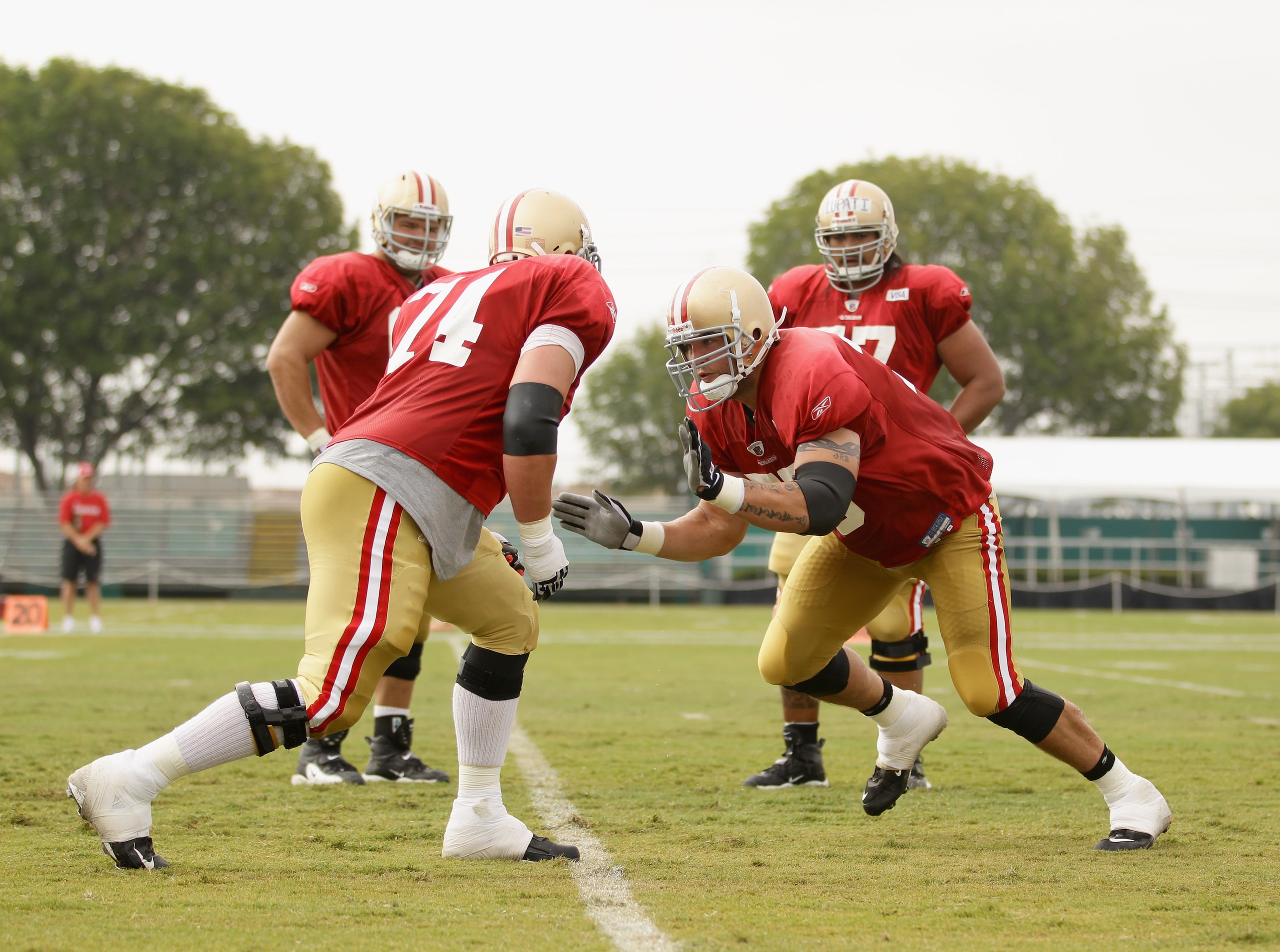 SANTA CLARA, CA - AUGUST 02:  Joe Staley #74 and Alex Boone #75 work out during the San Francisco 49ers training camp at their training complex on August 2, 2010 in Santa Clara, California.  (Photo by Ezra Shaw/Getty Images)