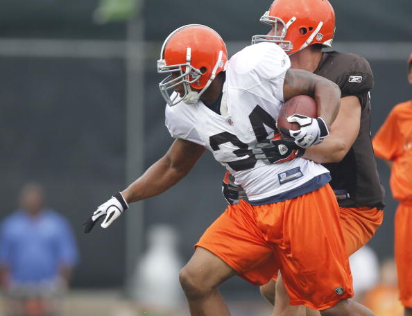 BEREA, OH - AUGUST 04:  Chris Jennings #34 of the Cleveland Browns tries to escape a tackle during training camp at the Cleveland Browns Training and Administrative Complex on August 4, 2010 in Berea, Ohio.  (Photo by Gregory Shamus/Getty Images)