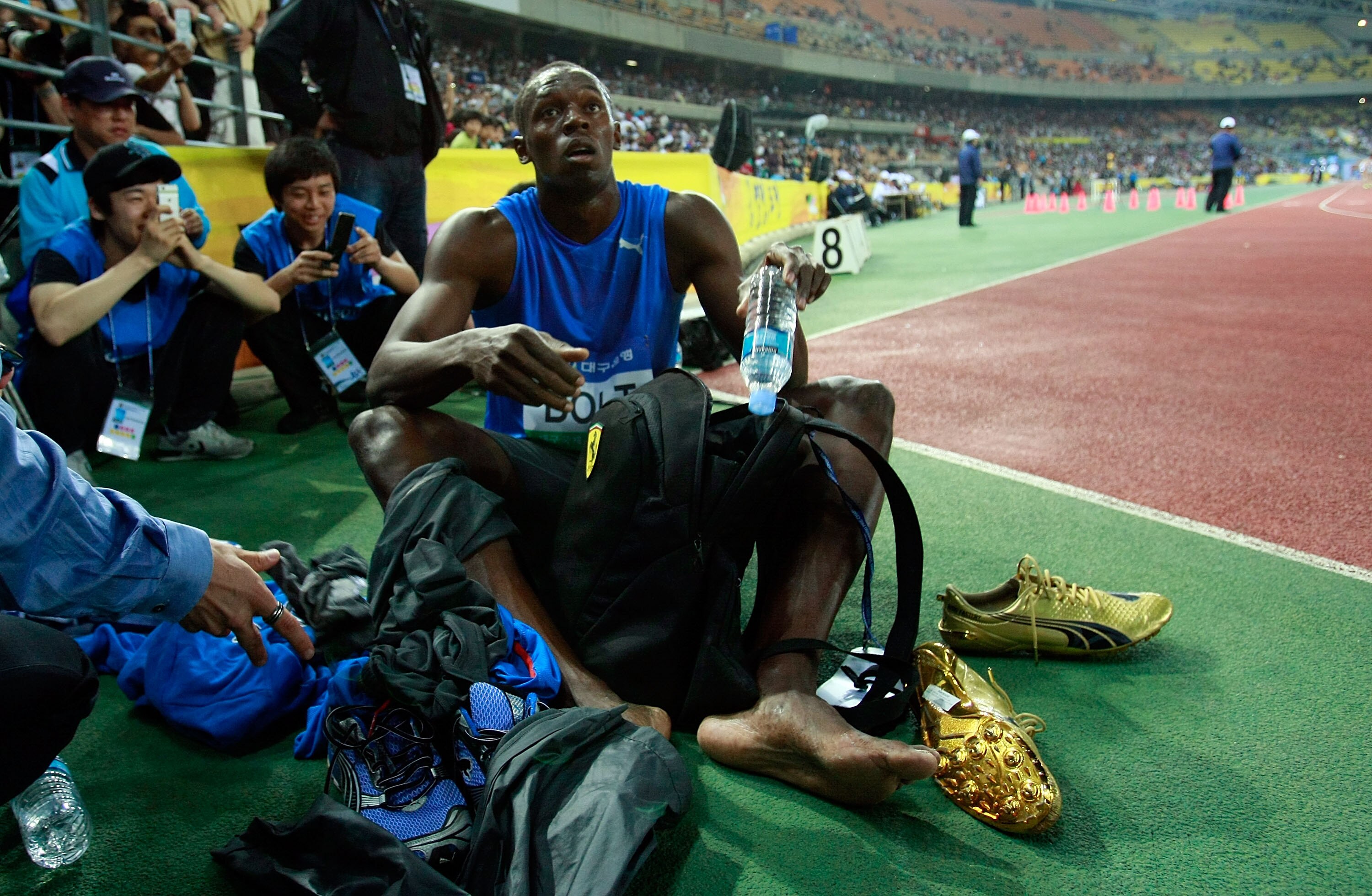 DAEGU, SOUTH KOREA - MAY 19:  Usain Bolt of Jamaica rests after winning the men's 100 metre race during the Colorful Daegu Pre-Championships Meeting 2010 at Daegu Stadium on May 19, 2010 in Daegu, South Korea. Bolt won the race at 9.86.  (Photo by Chung S