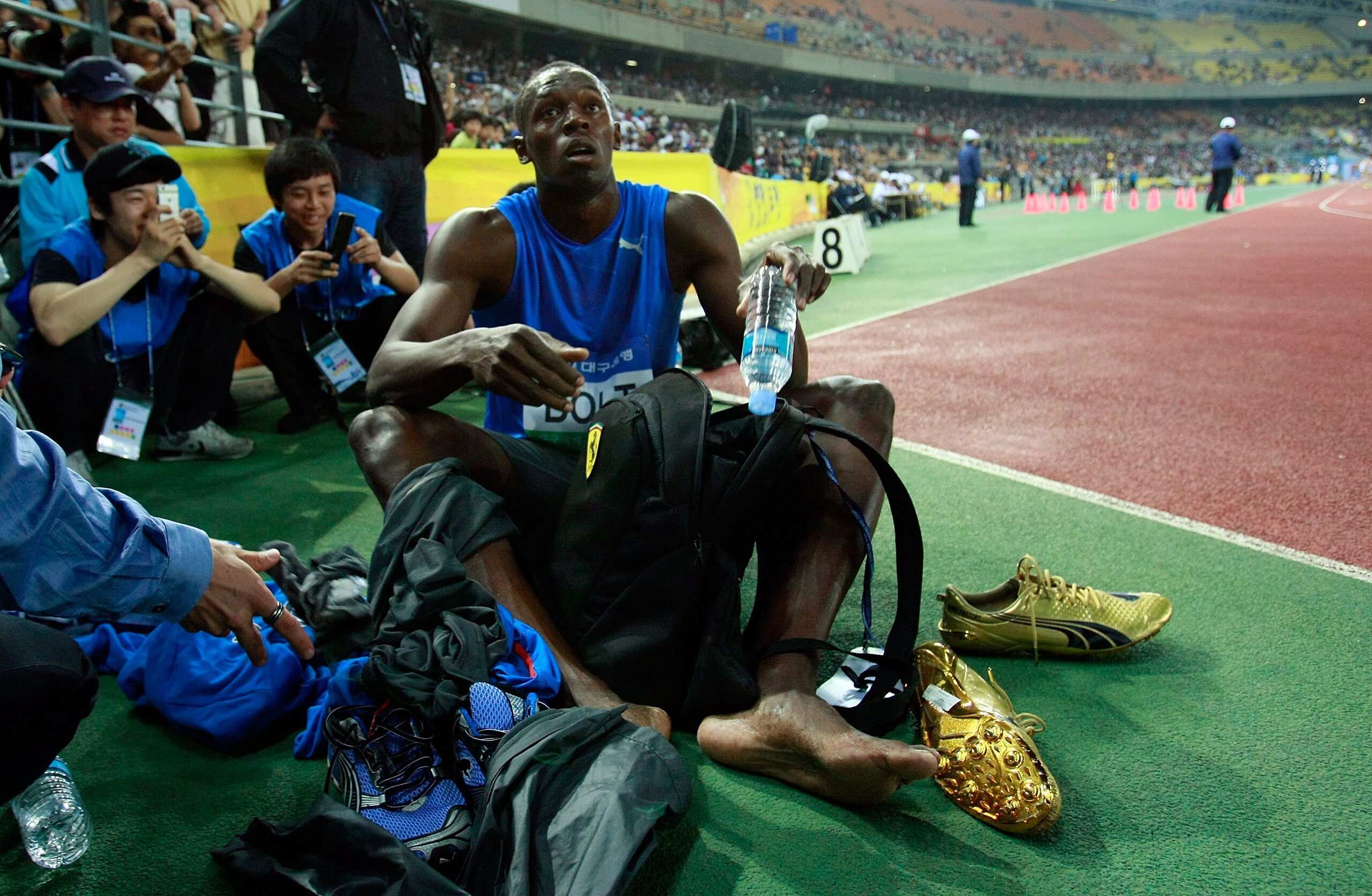 DAEGU, SOUTH KOREA - MAY 19: Usain Bolt of Jamaica rests after winning the men's 100 metre race during the Colorful Daegu Pre-Championships Meeting 2010 at Daegu Stadium on May 19, 2010 in Daegu, South Korea. Bolt won the race at 9.86. (Photo by Chung S DAEGU, SOUTH KOREA - MAY 19: Usain Bolt of Jamaica rests after winning the men's 100 metre race during the Colorful Daegu Pre-Championships Meeting 2010 at Daegu Stadium on May 19, 2010 in Daegu, South Korea. Bolt won the race at 9.86. (Photo by Chung S