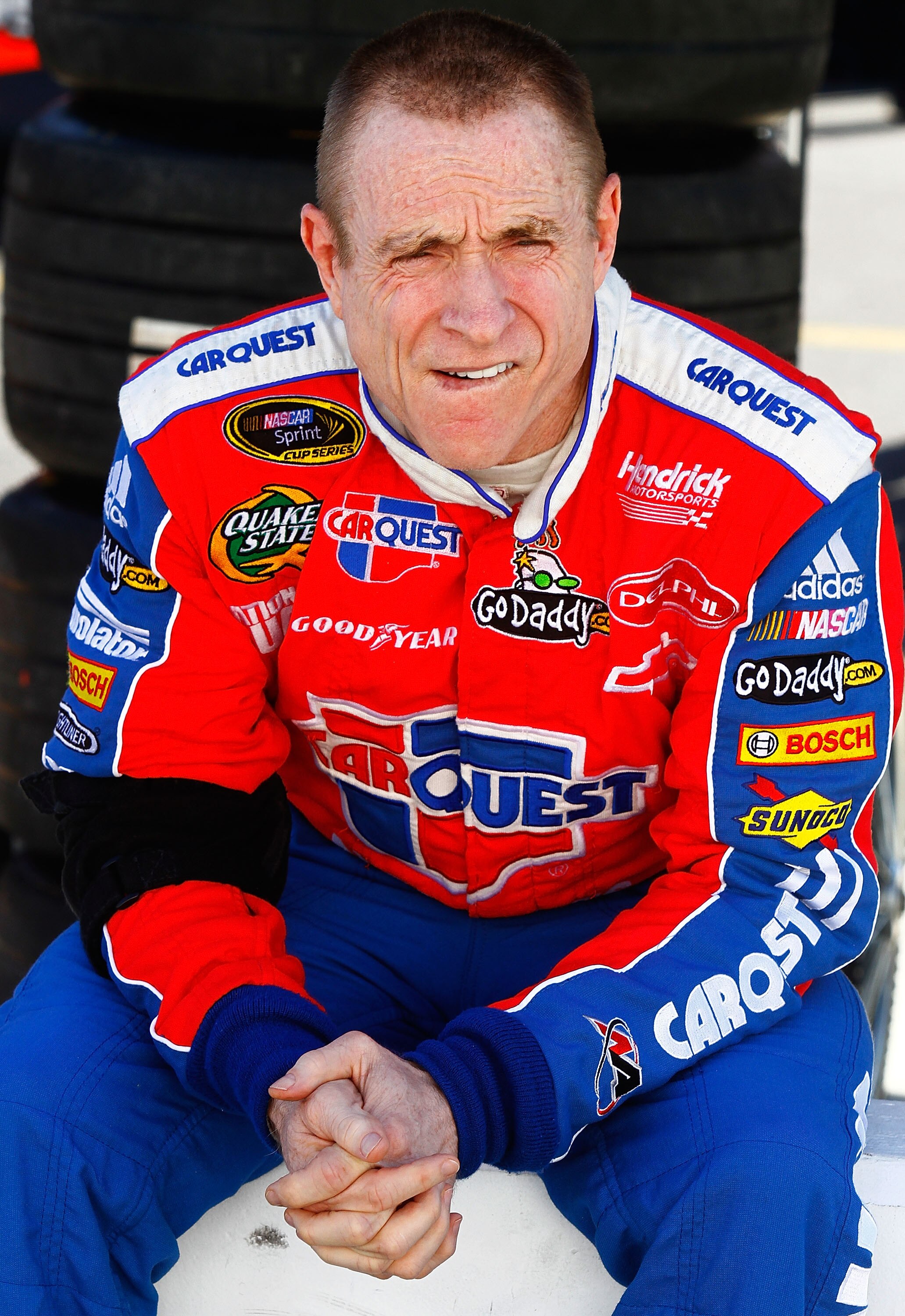 BRISTOL, TN - AUGUST 20:  Mark Martin, driver of the #5 CARQUEST Auto Parts Chevrolet, sits on pit wall during qualifying for the NASCAR Sprint Cup Series IRWIN Tools Night Race at Bristol Motor Speedway on August 20, 2010 in Bristol, Tennessee.  (Photo b