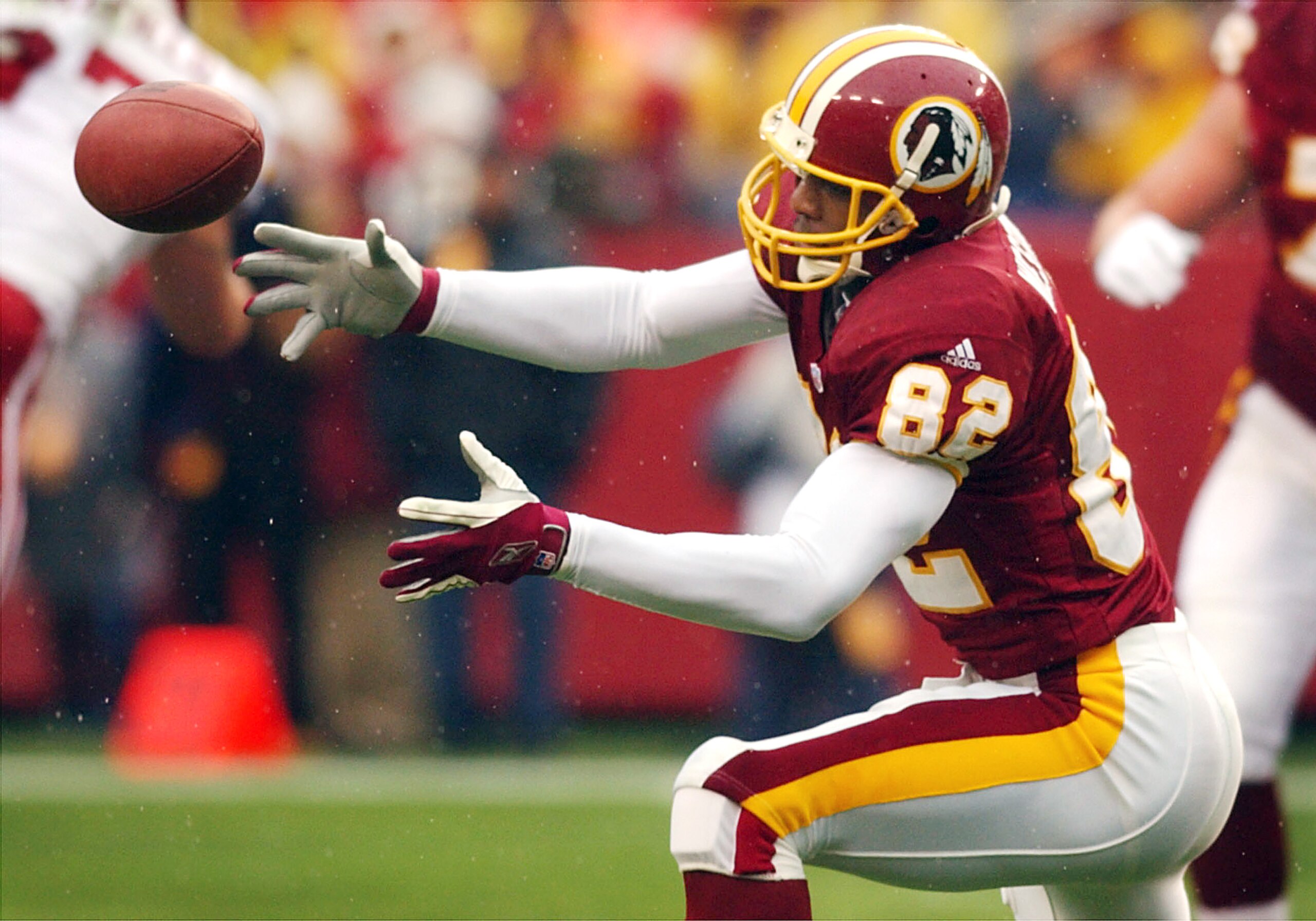 06 Jan 2002: Michael Westbrook #82 of the Washington Redskins is unable to get a handle on a pass against the Arizona Cardinals during week 17 NFL action at FedEx Field in Landover, Maryland. DIGITAL IMAGE. Mandatory Credit: Doug Pensinger/Getty Images 06 Jan 2002: Michael Westbrook #82 of the Washington Redskins is unable to get a handle on a pass against the Arizona Cardinals during week 17 NFL action at FedEx Field in Landover, Maryland. DIGITAL IMAGE. Mandatory Credit: Doug Pensinger/Getty Images