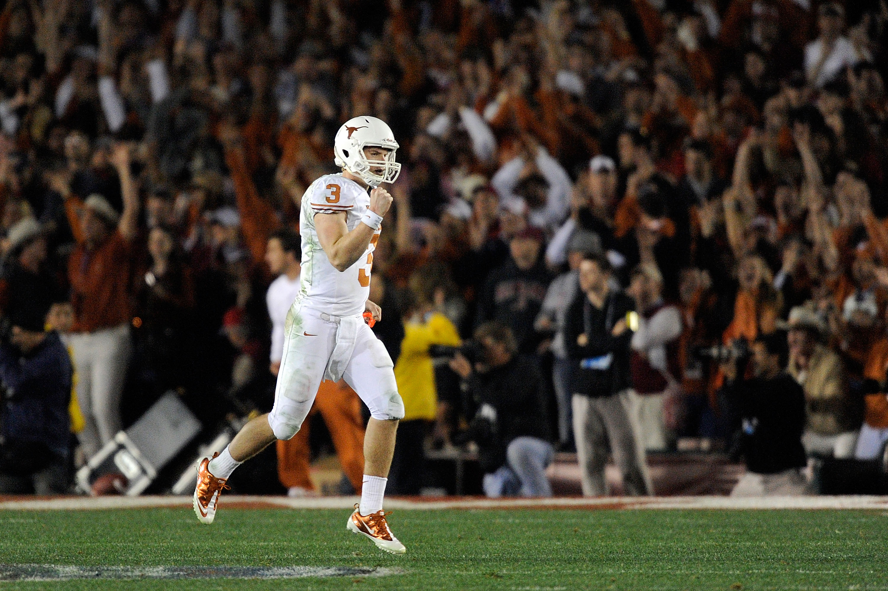 PASADENA, CA - JANUARY 07: Quarterback Garrett Gilbert #3 of the Texas Longhorns celebrates after wide receiver Jordan Shipley #8 scores a 28-yard touchdown against the Alabama Crimson Tide during the fourth quarter of the Citi BCS National Championship PASADENA, CA - JANUARY 07: Quarterback Garrett Gilbert #3 of the Texas Longhorns celebrates after wide receiver Jordan Shipley #8 scores a 28-yard touchdown against the Alabama Crimson Tide during the fourth quarter of the Citi BCS National Championship