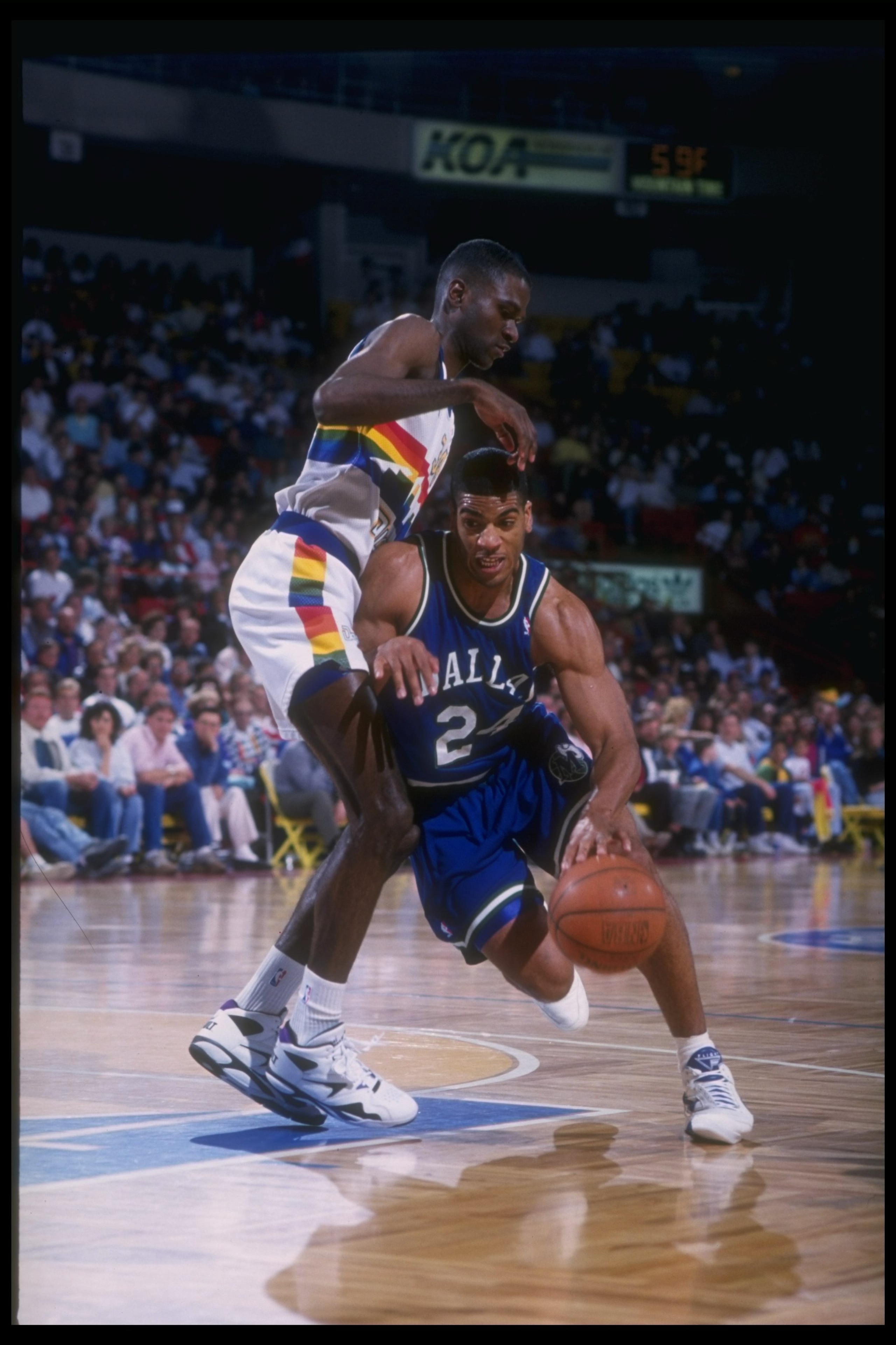 1992-1993:  Guard Jim Jackson of the Dallas Mavericks moves the ball during a game against the Denver Nuggets at McNichols Arena in Denver, Colorado. Mandatory Credit: Tim DeFrisco  /Allsport Mandatory Credit: Tim DeFrisco  /Allsport