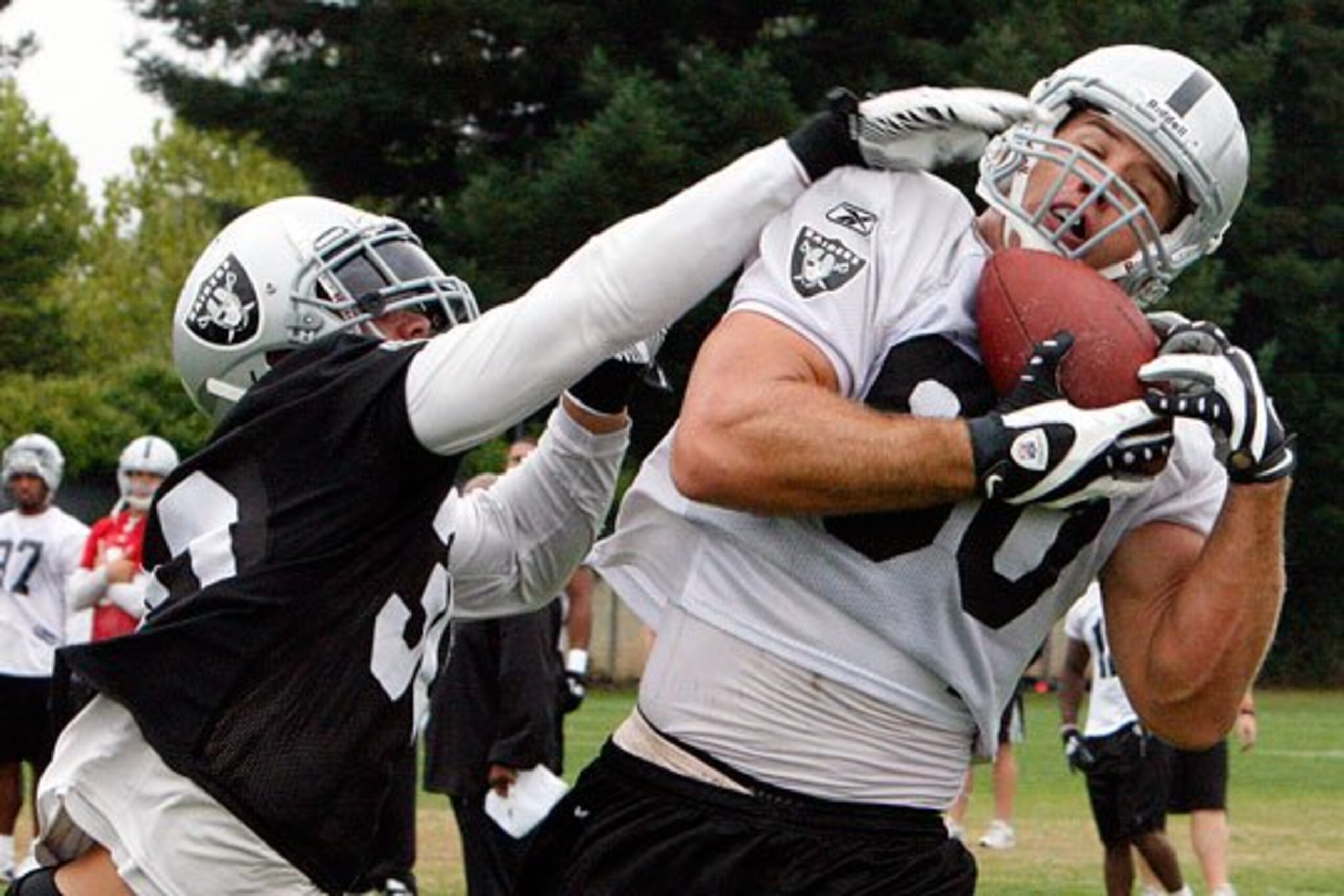 Zach Miller out fights Mike Mitchell to make the tough catch.