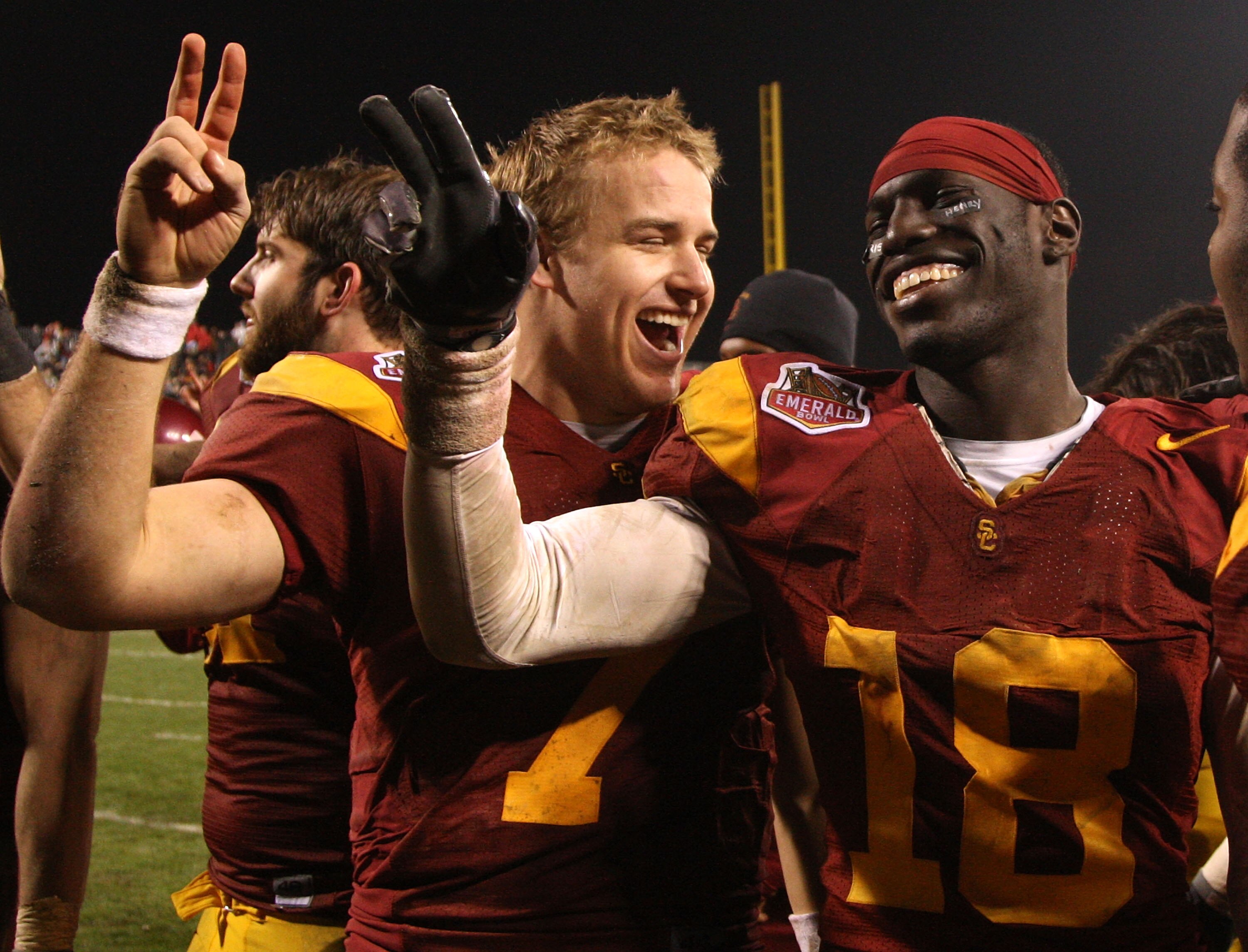 SAN FRANCISCO - DECEMBER 26: Matt Barkley #7 and Damian Williams #18 of the USC Trojans celebrate after defeating the Boston College Eagles during the 2009 Emerald Bowl at AT&T Park on December 26, 2009 in San Francisco, California. (Photo by Jed Jacobsoh SAN FRANCISCO - DECEMBER 26: Matt Barkley #7 and Damian Williams #18 of the USC Trojans celebrate after defeating the Boston College Eagles during the 2009 Emerald Bowl at AT&T Park on December 26, 2009 in San Francisco, California. (Photo by Jed Jacobsoh