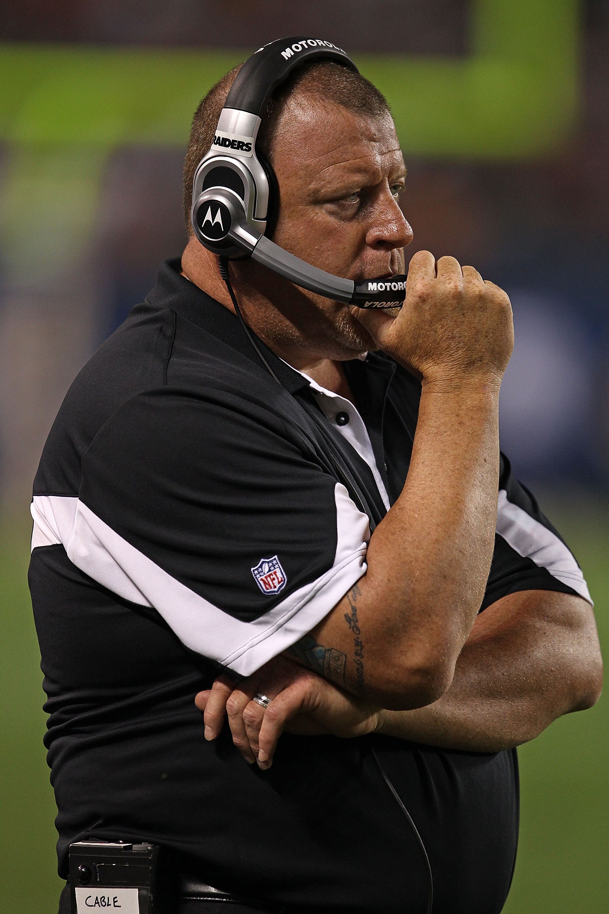 CHICAGO - AUGUST 21: Head coach Tom Cable of the Oakland Raiders watches as his team takes on the Chicago Bears during a preseason game at Soldier Field on August 21, 2010 in Chicago, Illinois. The Raiders defeated the Bears 32-17. (Photo by Jonathan Dani CHICAGO - AUGUST 21: Head coach Tom Cable of the Oakland Raiders watches as his team takes on the Chicago Bears during a preseason game at Soldier Field on August 21, 2010 in Chicago, Illinois. The Raiders defeated the Bears 32-17. (Photo by Jonathan Dani