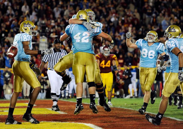 LOS ANGELES, CA - NOVEMBER 28: Chane Moline #42 of the UCLA Bruins celebrates his touchdown against USC Trojans during the fourth quarter of the NCAA college football game at Los Angeles Memorial Coliseum on November 28, 2009 in Los Angeles, California. LOS ANGELES, CA - NOVEMBER 28: Chane Moline #42 of the UCLA Bruins celebrates his touchdown against USC Trojans during the fourth quarter of the NCAA college football game at Los Angeles Memorial Coliseum on November 28, 2009 in Los Angeles, California.