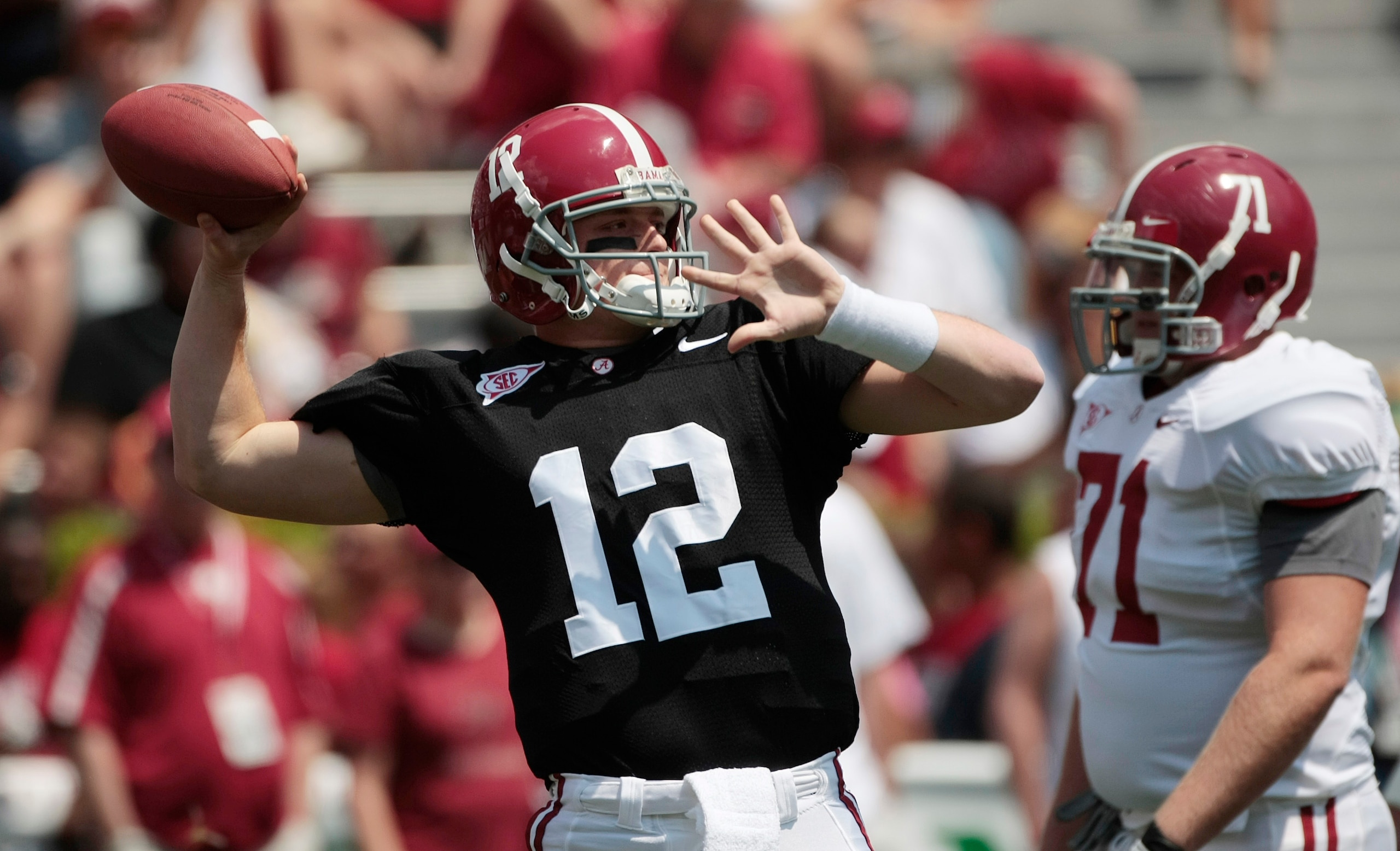 TUSCALOOSA, AL - APRIL 17: Quarterback Greg McElroy #12 of the University of Alabama looks for a receiver during the Alabama spring game at Bryant Denny Stadium on April 17, 2010 in Tuscaloosa, Alabama. (Photo by Dave Martin/Getty Images)