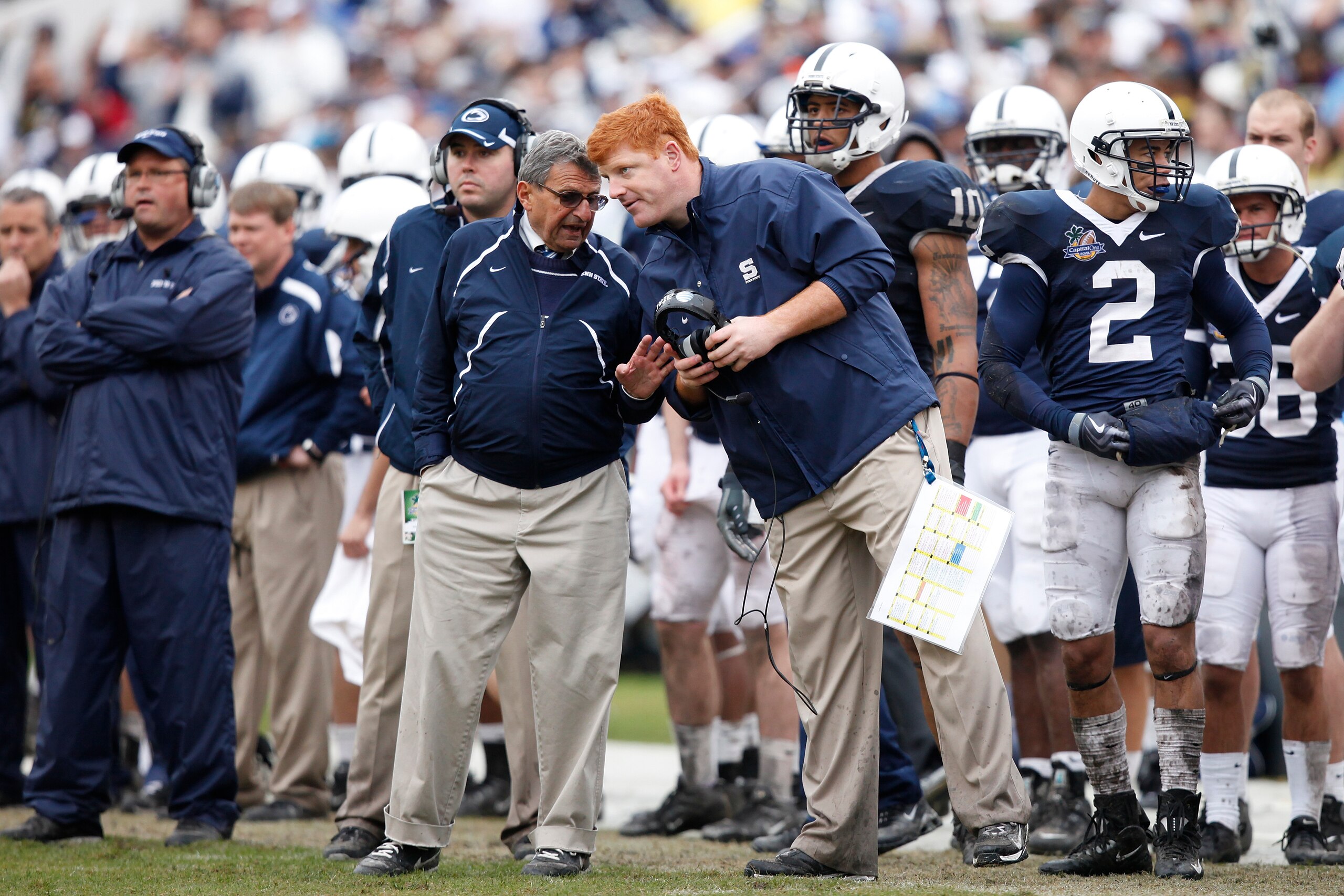 ORLANDO, FL - JANUARY 1: Head coach Joe Paterno of the Penn State Nittany Lions talks with offensive assistant coach Mike McQueary during the 2010 Capital One Bowl against the LSU Tigers at the Florida Citrus Bowl Stadium on January 1, 2010 in Orlando, Fl