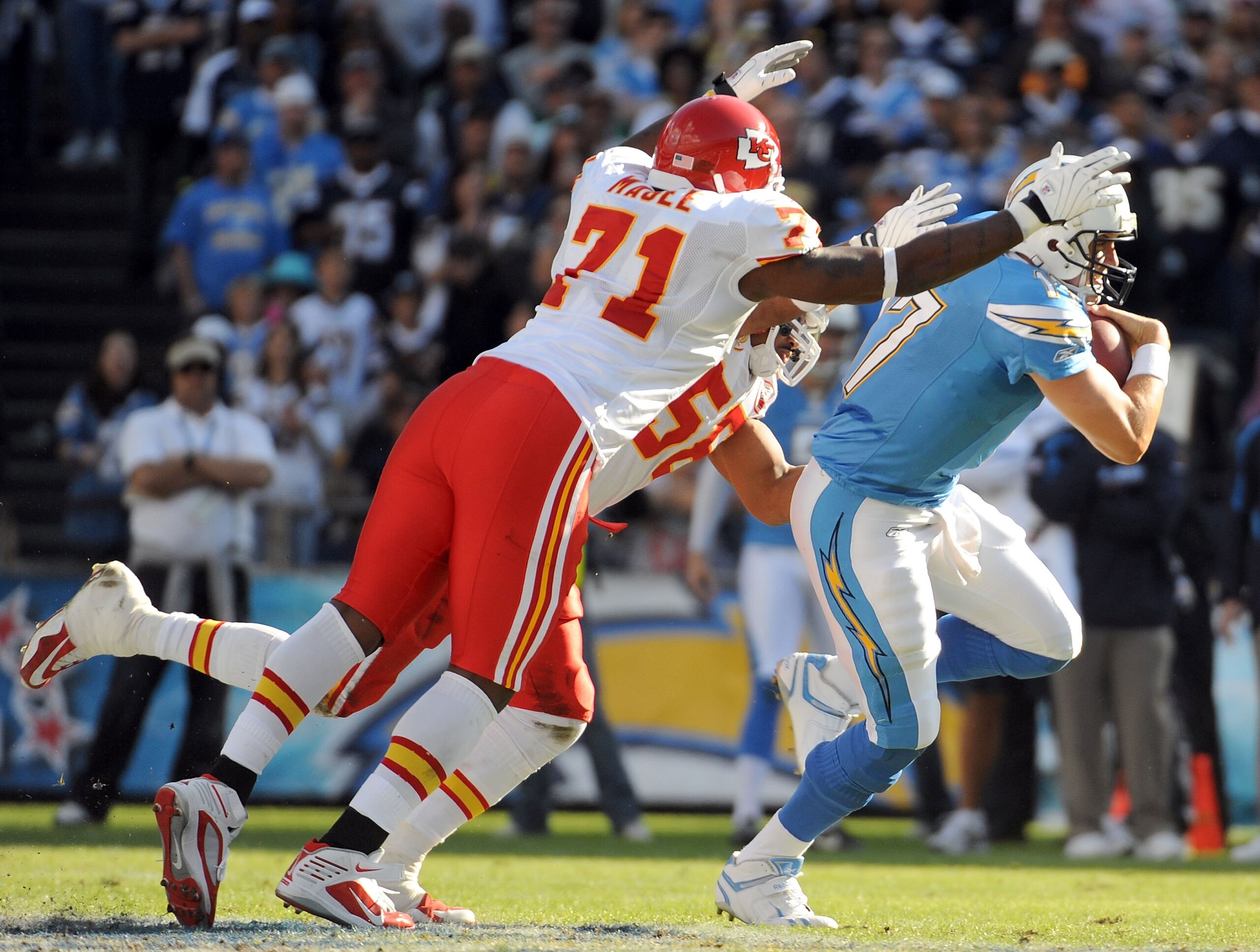 SAN DIEGO - NOVEMBER 29:  Philip Rivers #17 of the San Diego Chargers is chased by Alex Magee #71 and Derrick Johnson #56 of the Kansas City Chiefs at Qualcomm Stadium on November 29, 2009 in San Diego, California.  (Photo by Harry How/Getty Images)