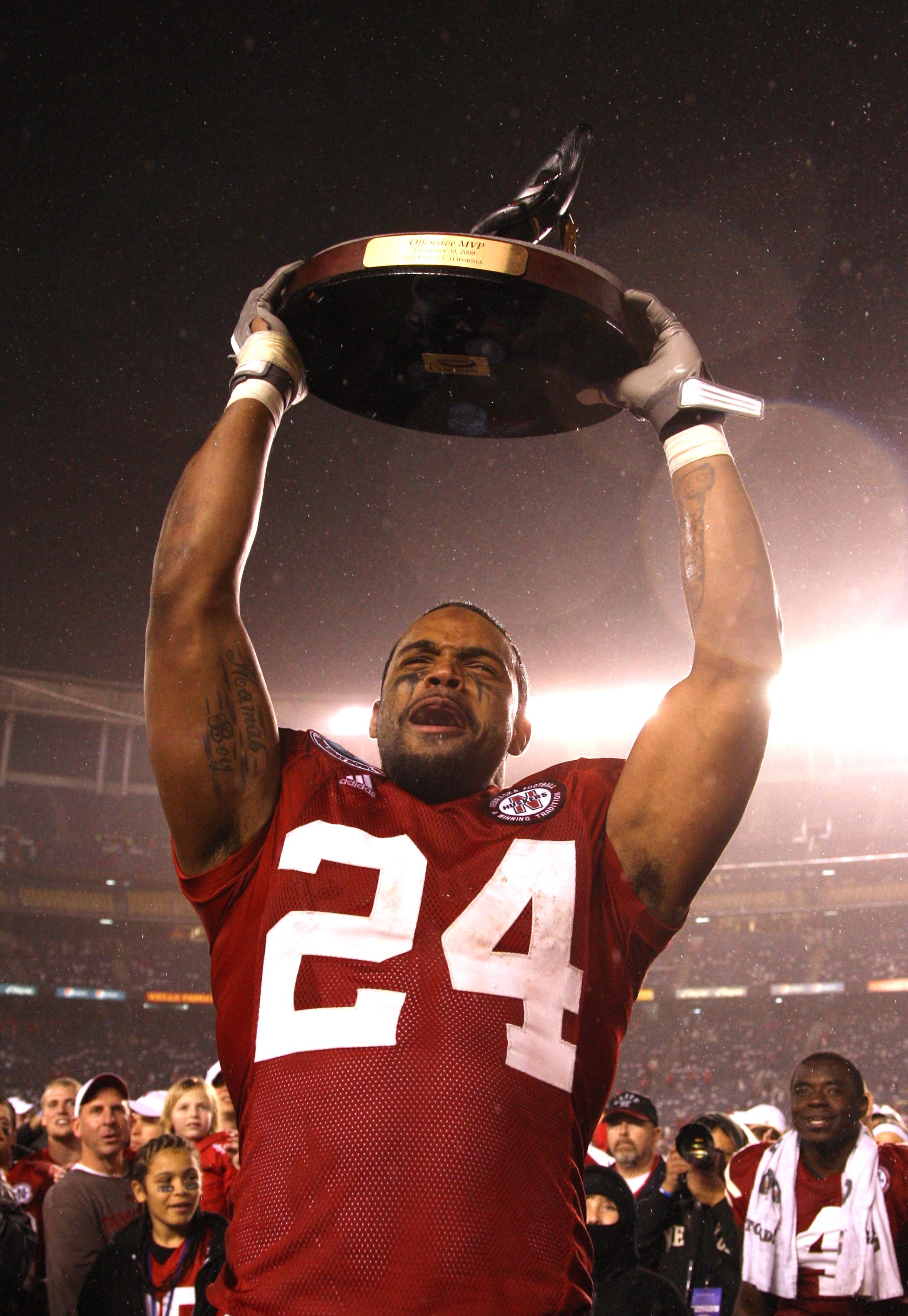 SAN DIEGO - DECEMBER 30:  Offensive Player of the Game wide receiver Niles Paul #24 of the University of Nebraska Cornhuskers hoists the Offensive Player MVP trophy after defeating the University of Arizona Wildcats in the Pacific Life Holiday Bowl, on De