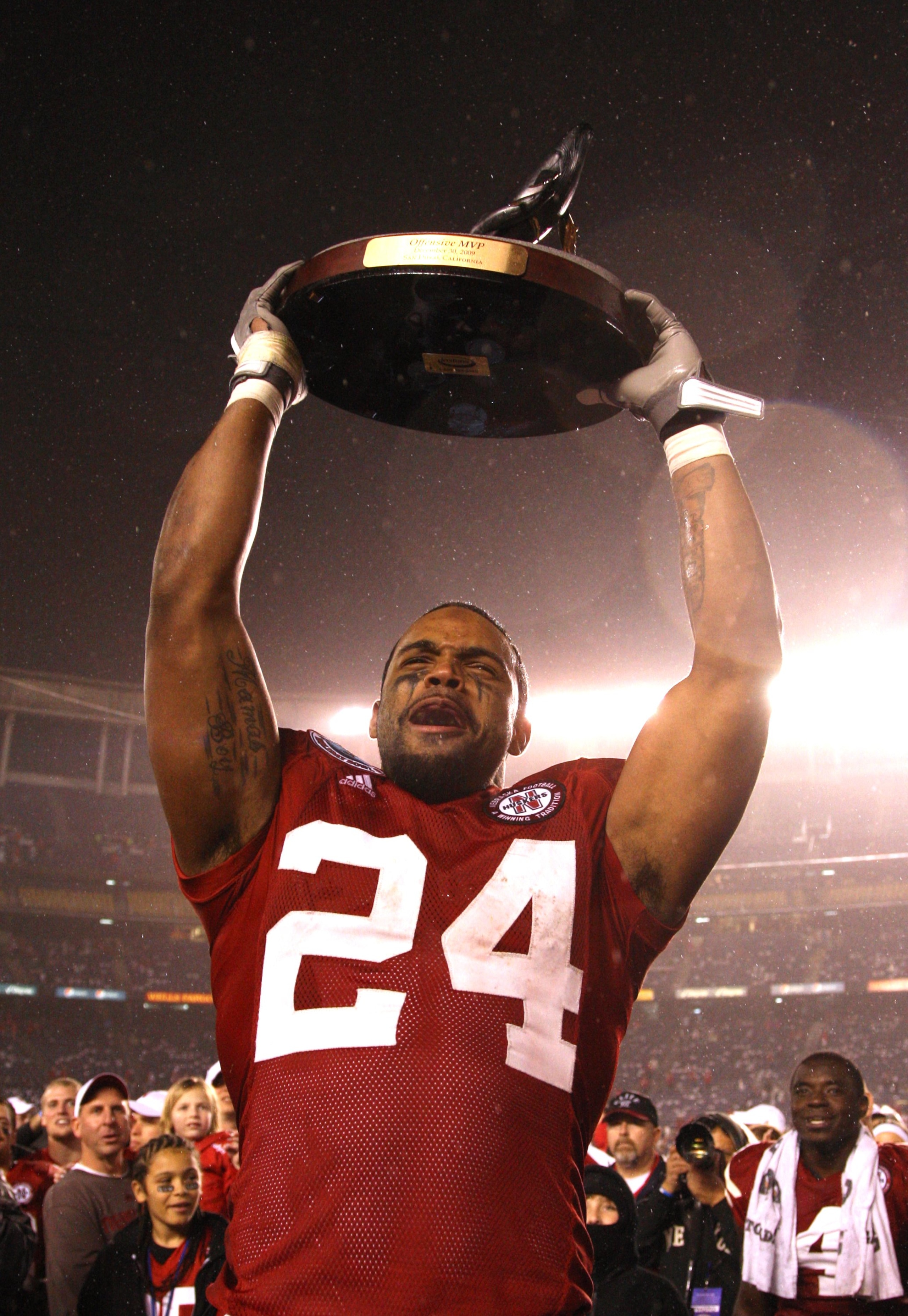 SAN DIEGO - DECEMBER 30:  Offensive Player of the Game wide receiver Niles Paul #24 of the University of Nebraska Cornhuskers hoists the Offensive Player MVP trophy after defeating the University of Arizona Wildcats in the Pacific Life Holiday Bowl, on De